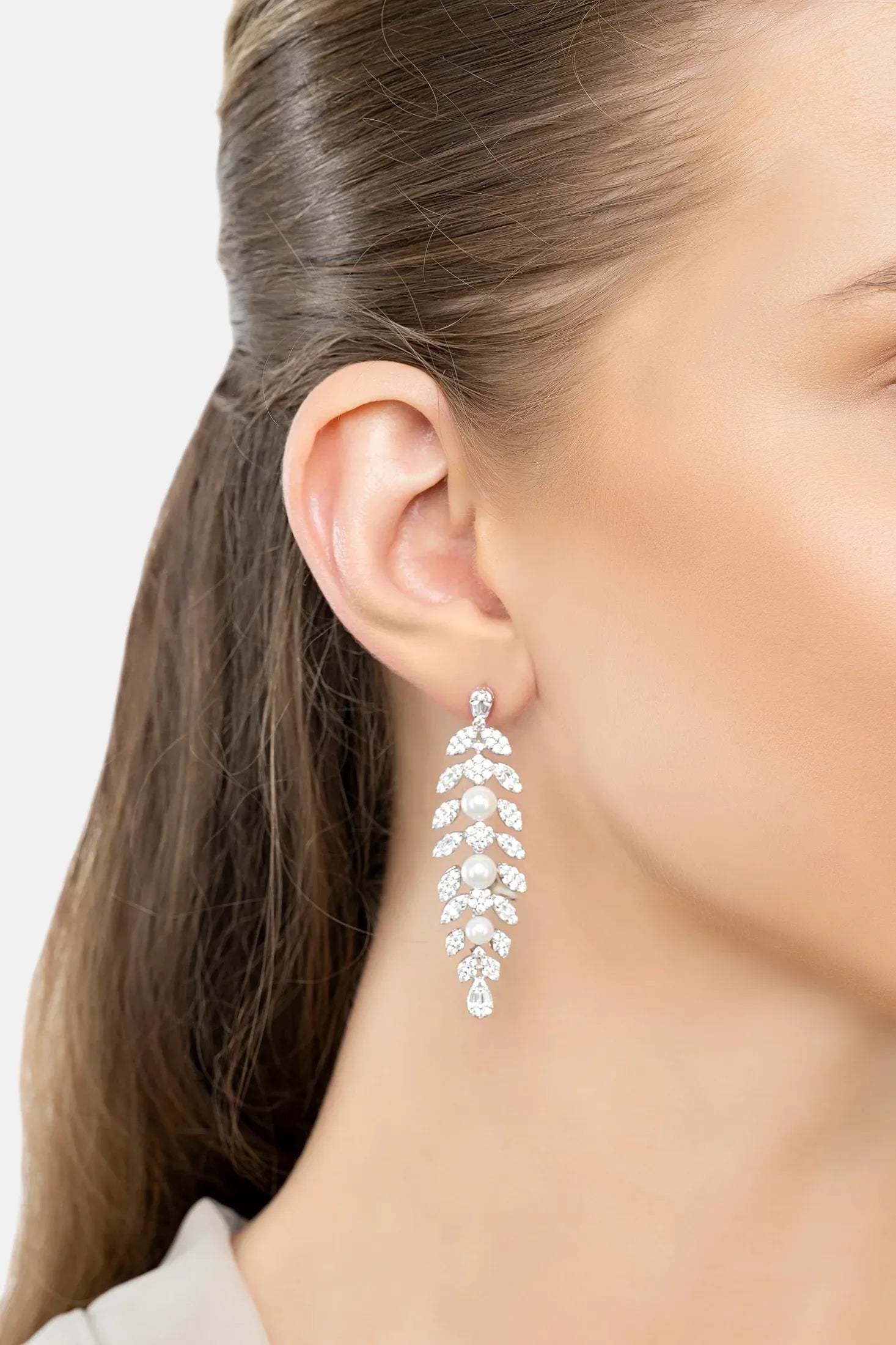 The earring worn by a model.