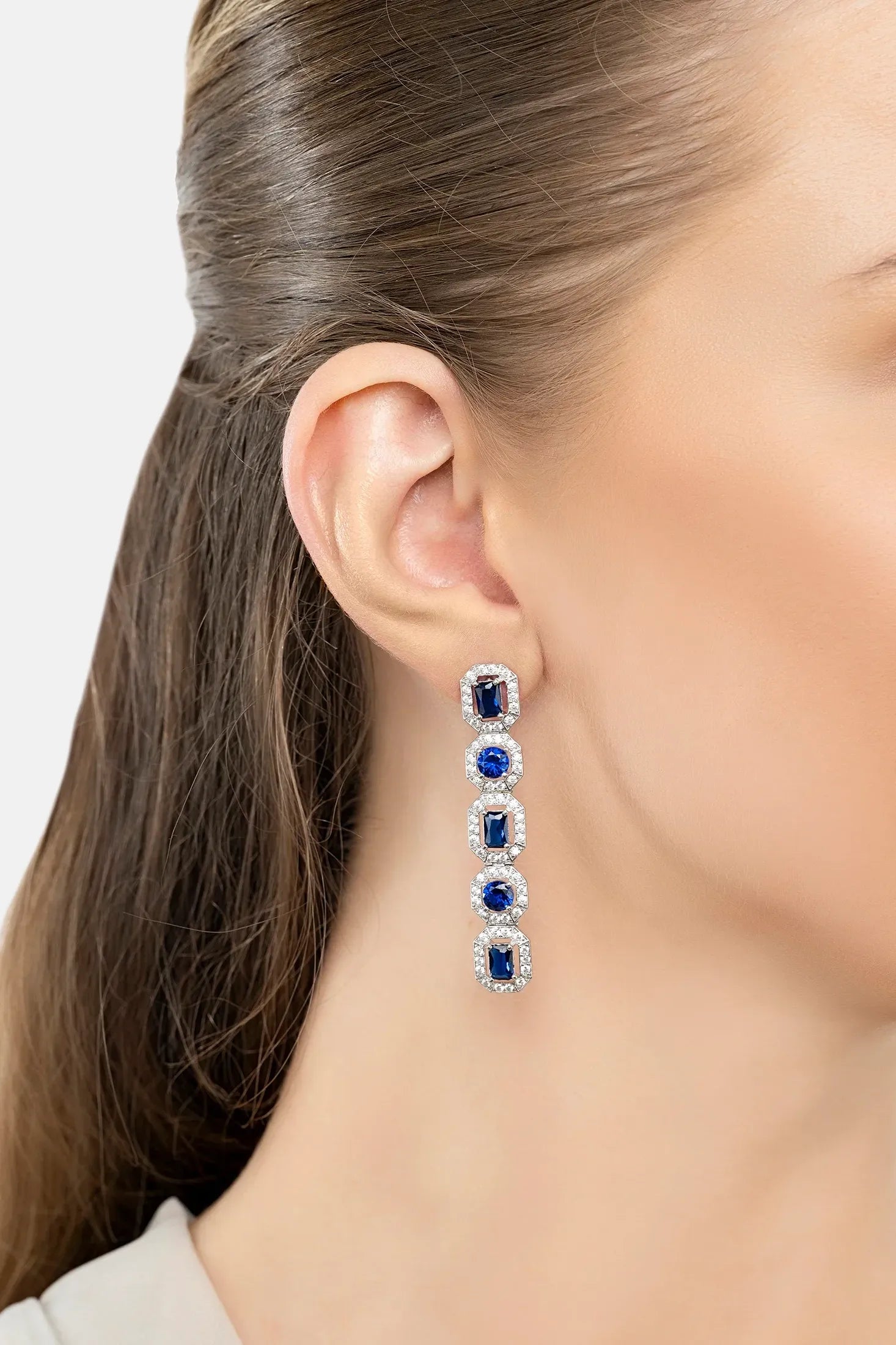 The earring worn by a model.
