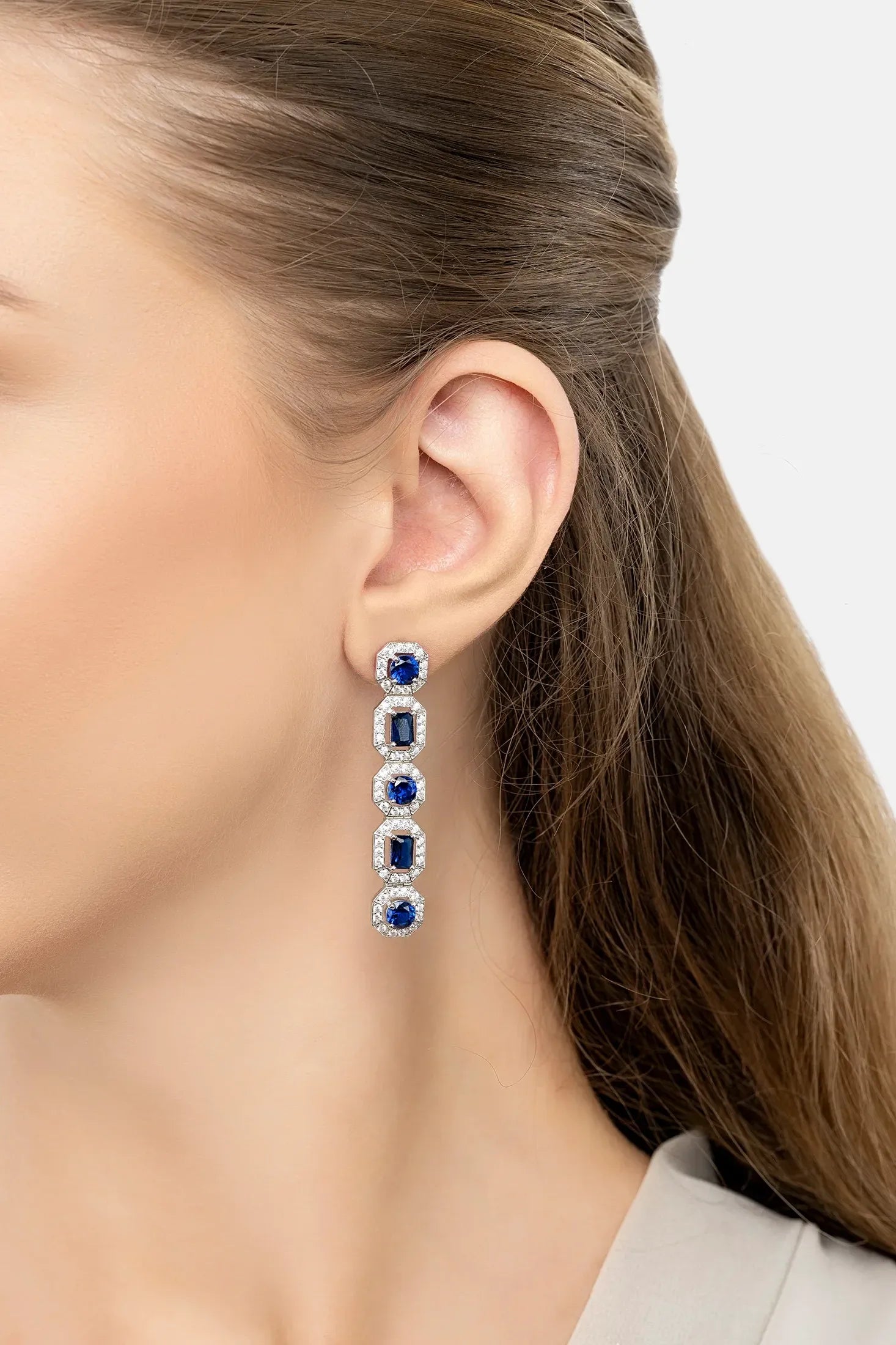 The earring worn by a model.
