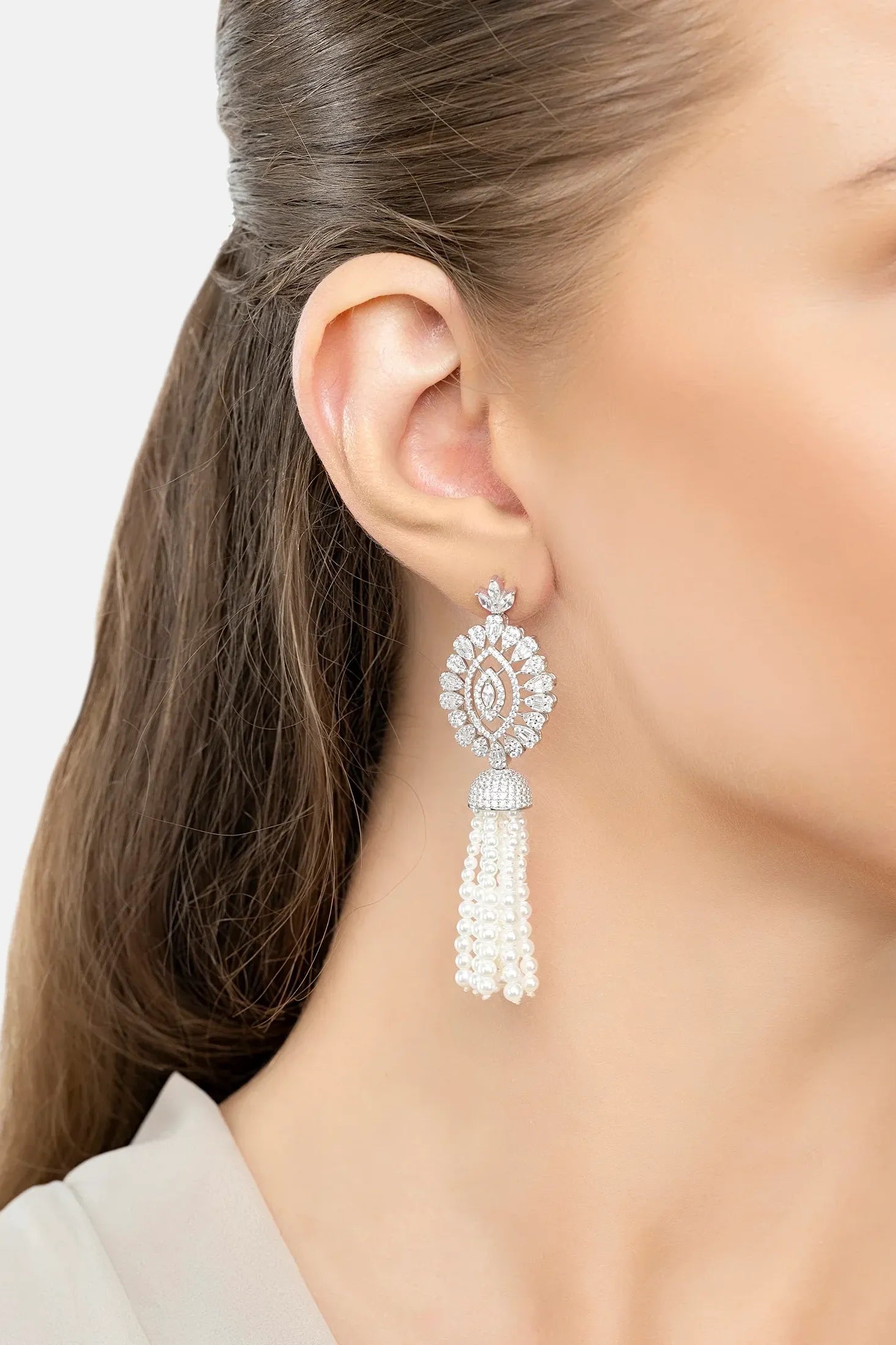 The earring worn by a model.