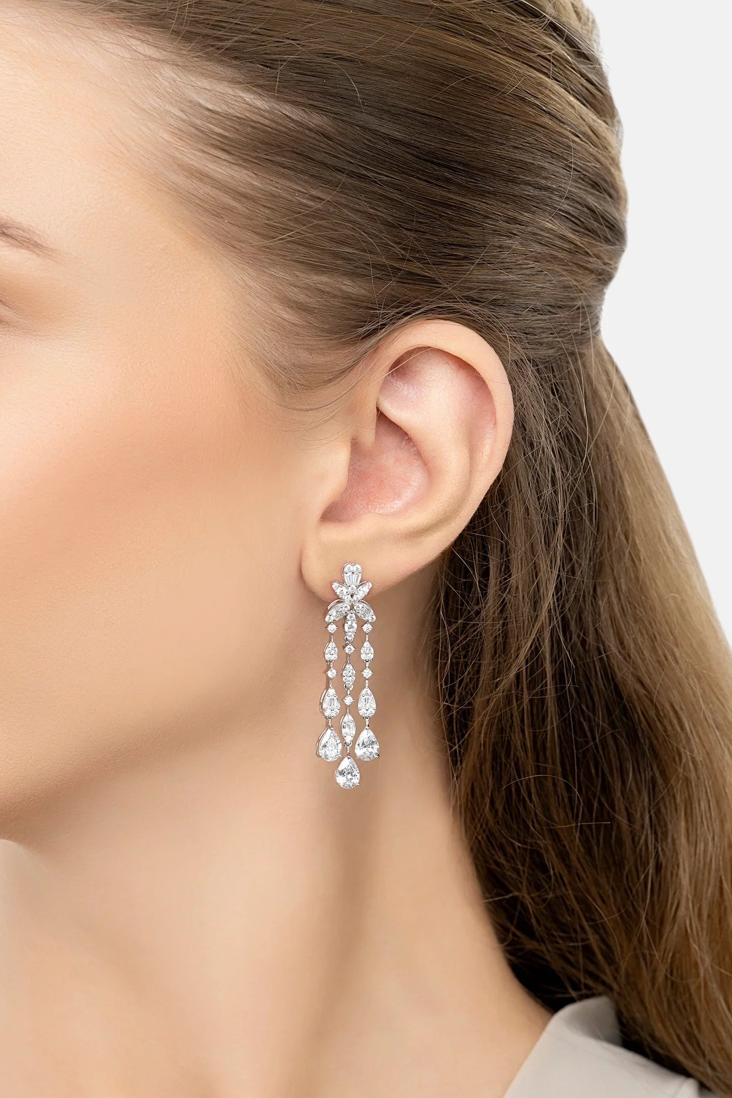 The earring worn by a model.