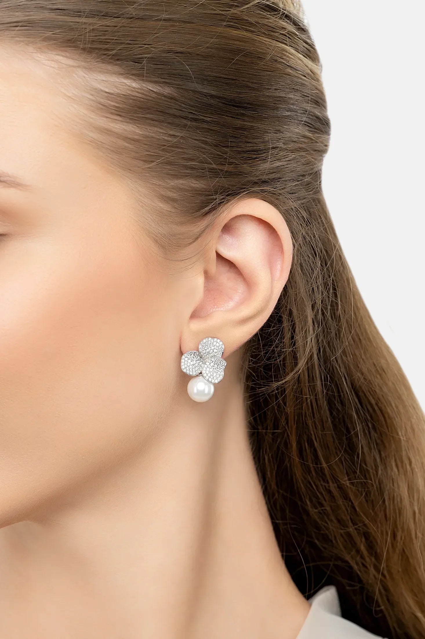 The earring worn by a model.