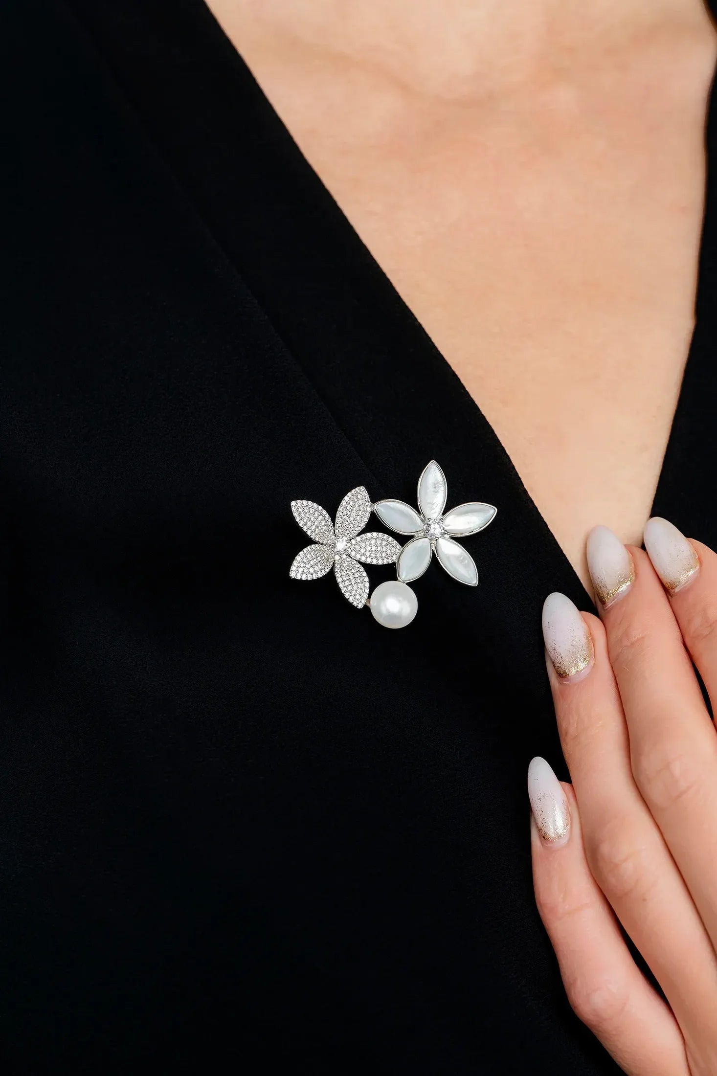 The brooch worn by a model.