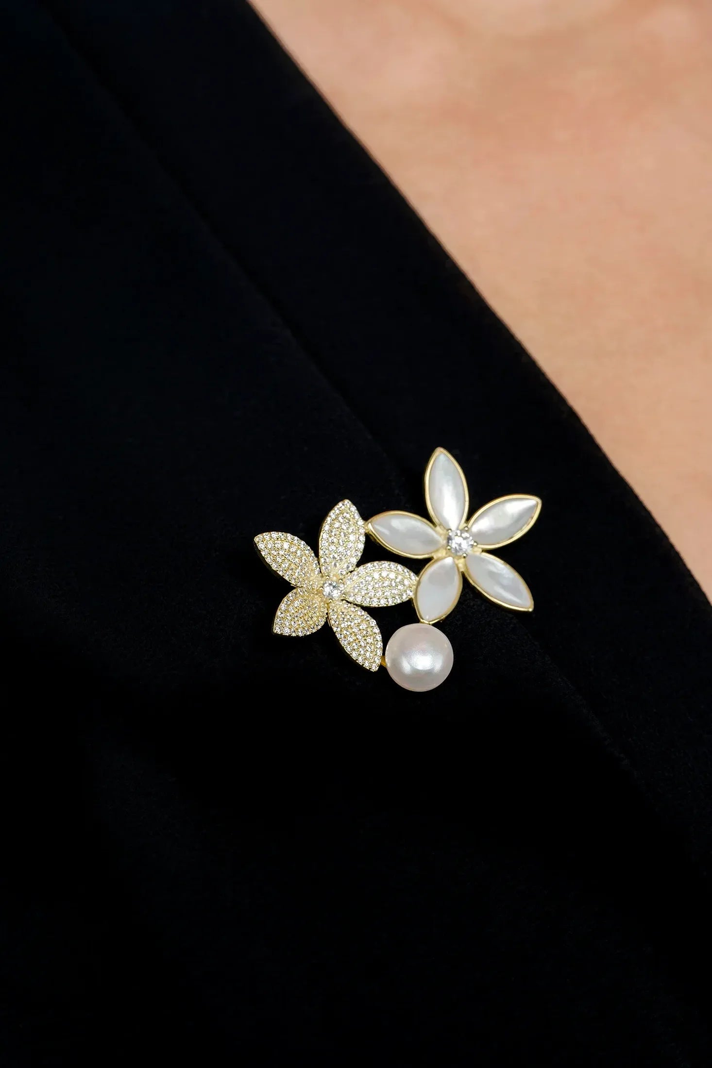 The brooch worn by a model.