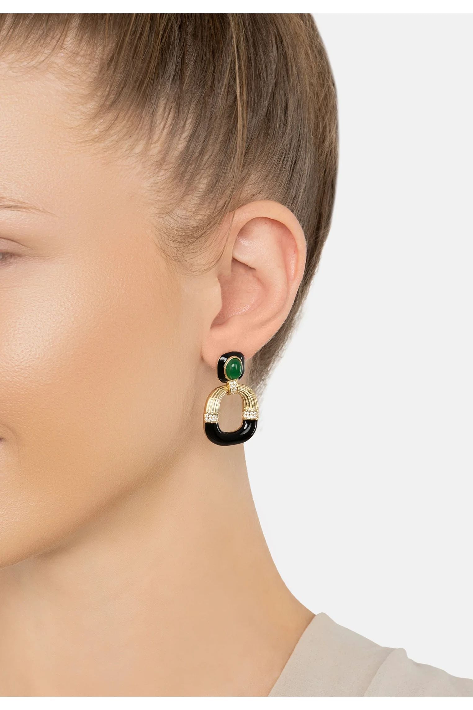 The earring worn by a model.