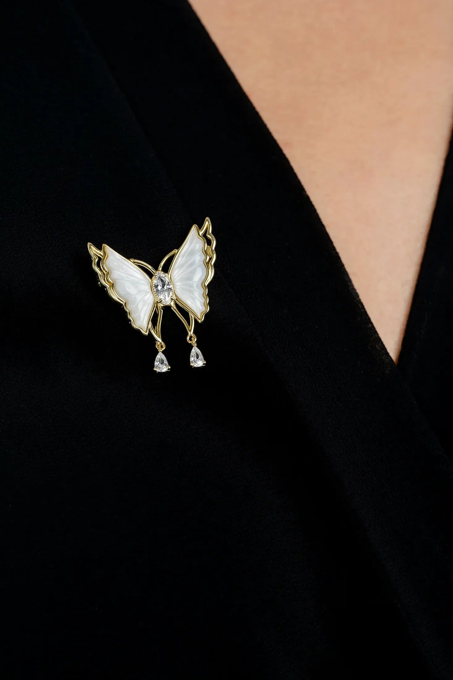 The brooch worn by a model.