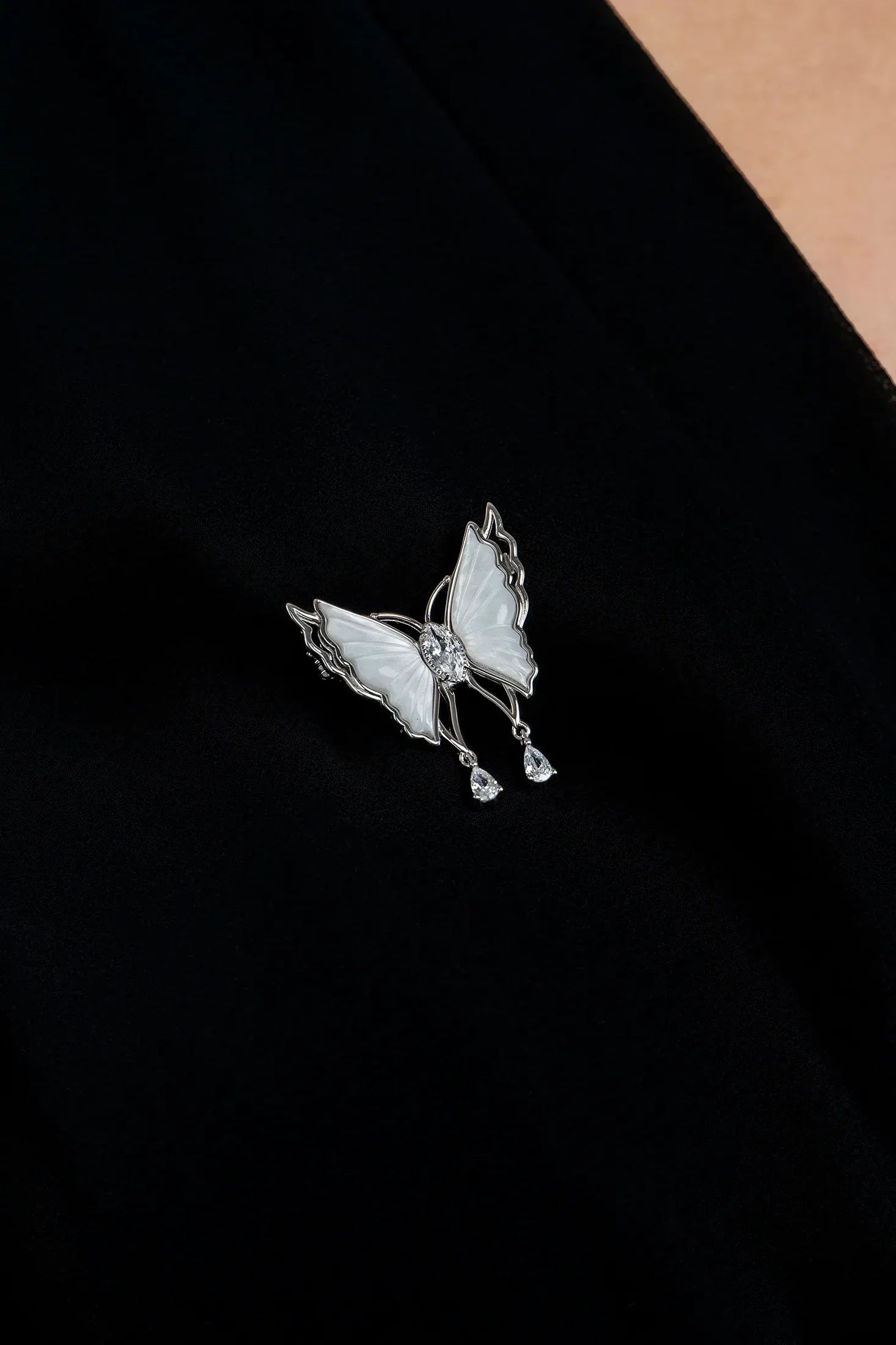 The brooch worn by a model.