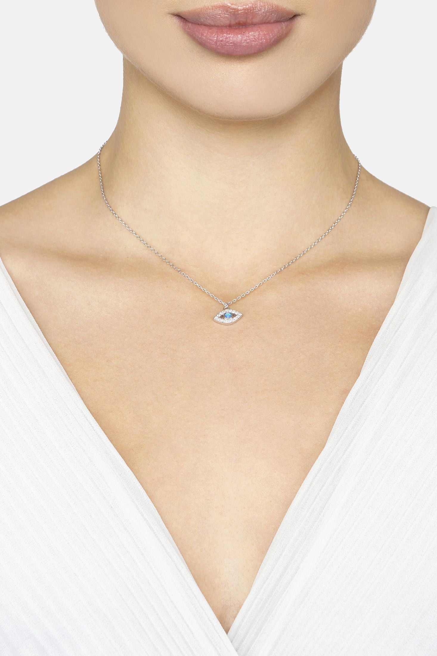 Necklace with a pendant on a model wearing a white top