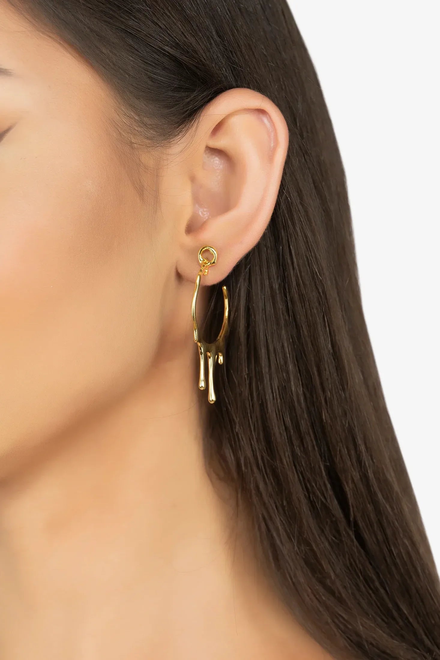 The earring worn by a model.