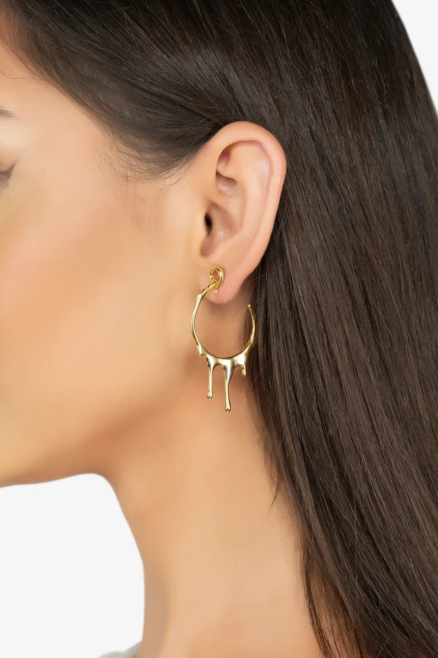 The earring worn by a model.