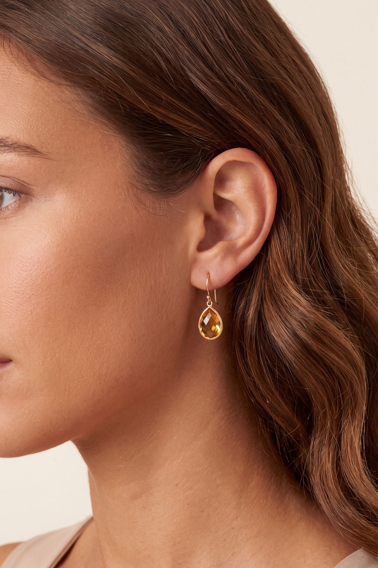 Gold drop earring with faceted amber gemstone, hypoallergenic and handcrafted for everyday elegance.