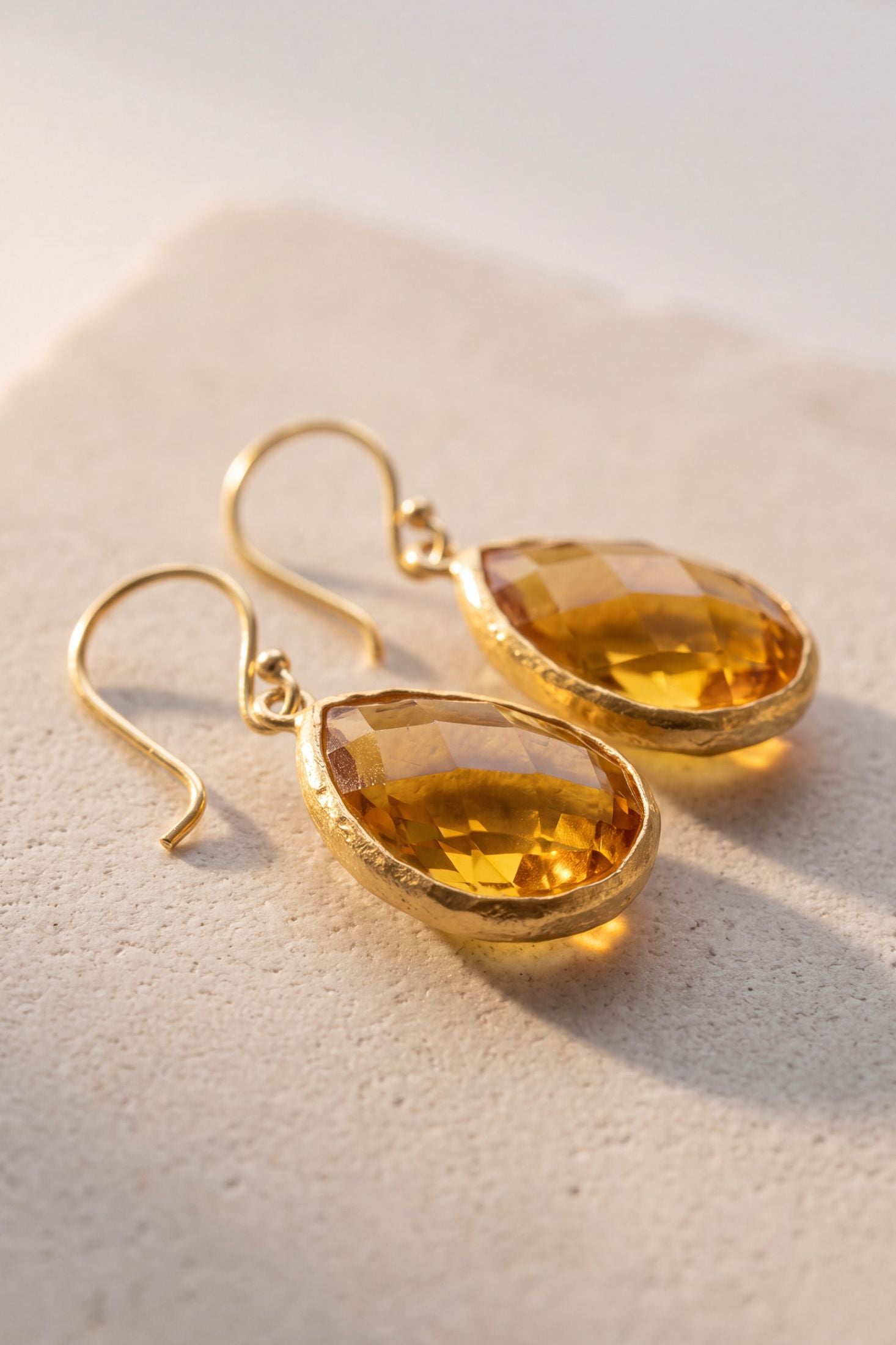 Faceted citrine drop earrings in gold, handcrafted with ethical, hypoallergenic materials for sustainable luxury.
