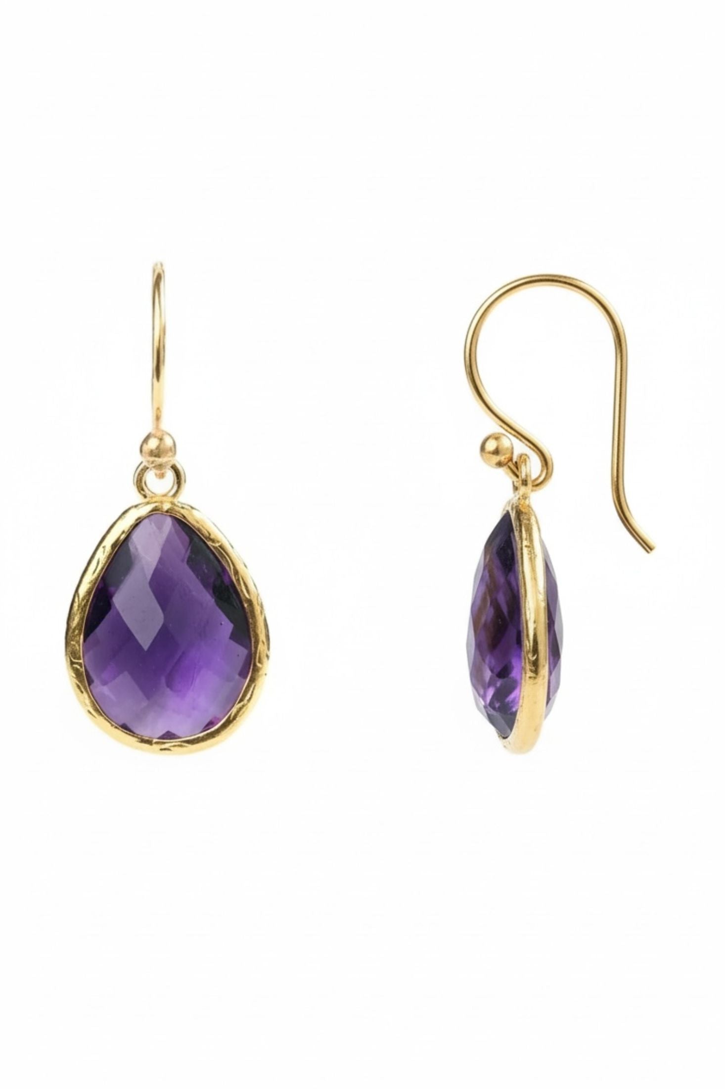 Gold earrings with purple teardrop-shaped gemstones on a white background