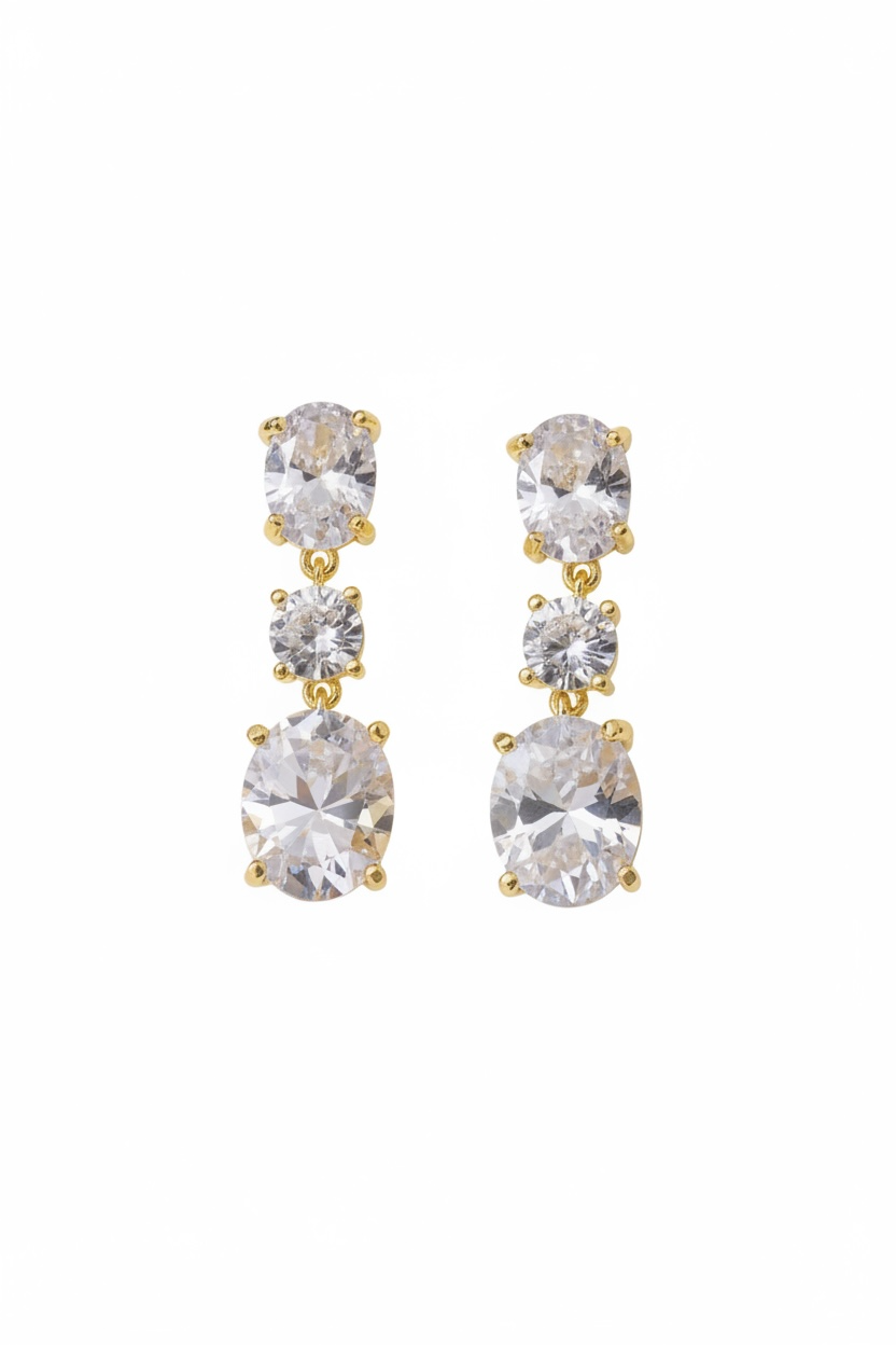 Gold and clear crystal drop earrings on a white background