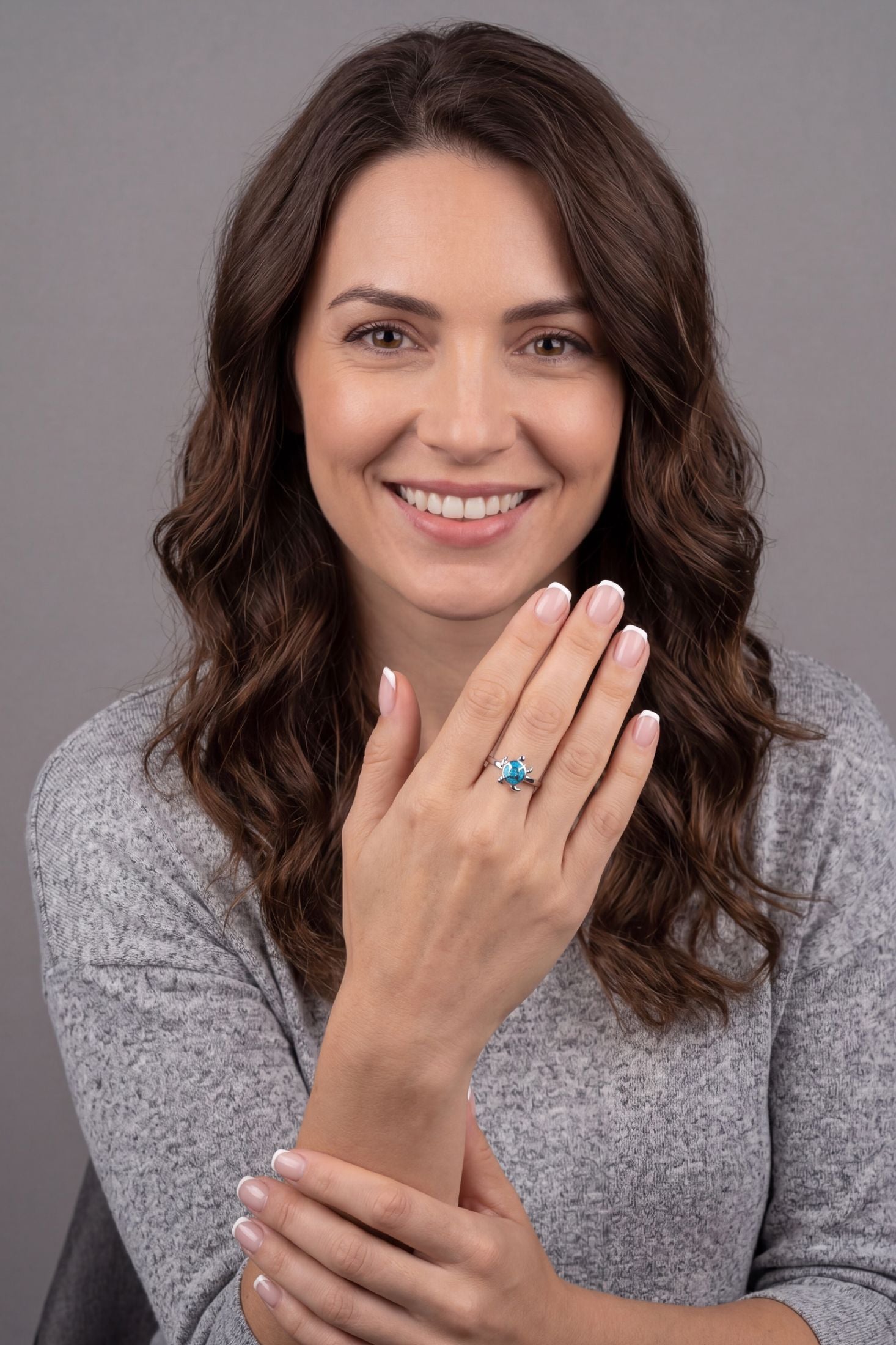 Turtle Blue Opalite Ring Silver worn by a model, showing how it looks when worn and its scale.