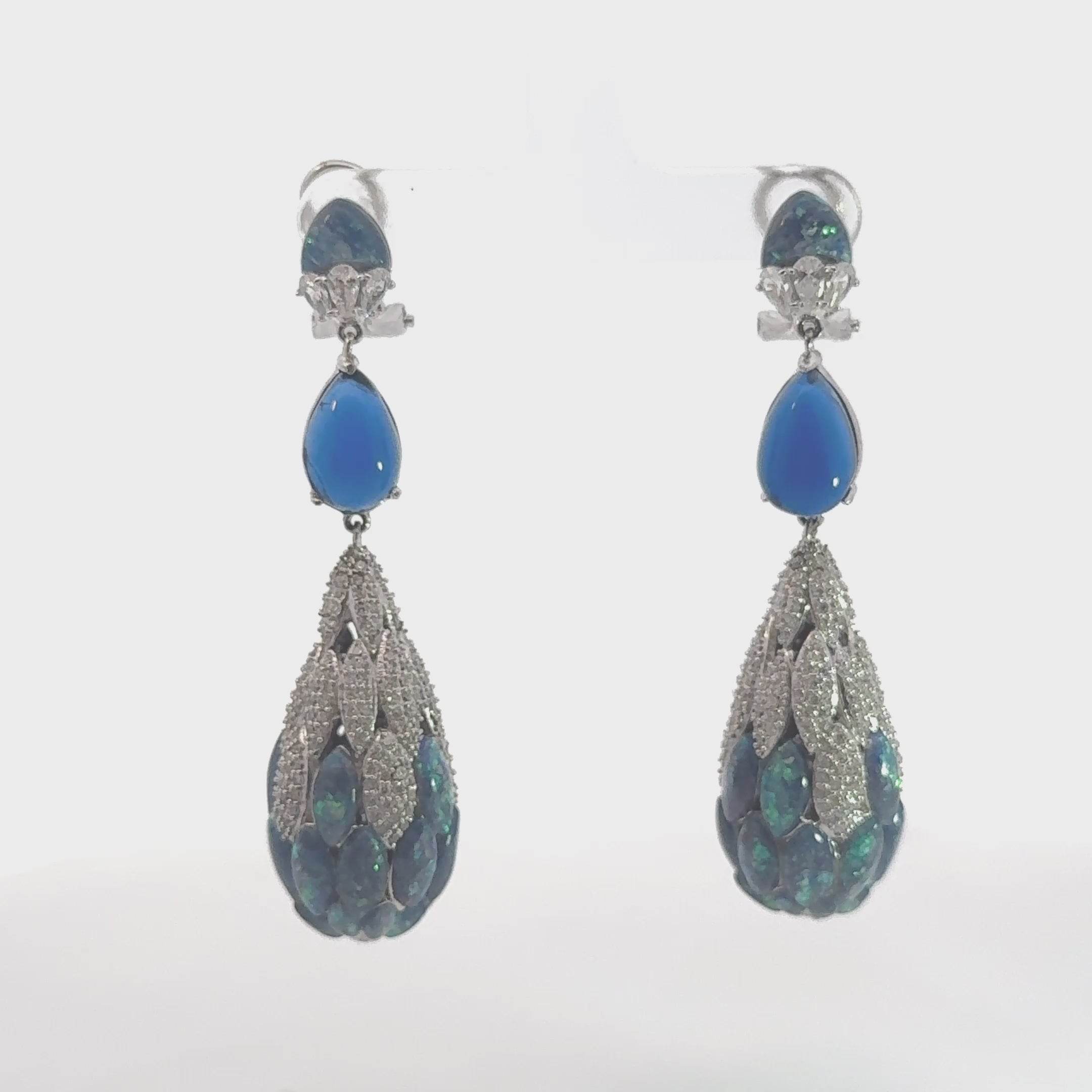 Video of Carmen Green Opal Drop Earrings Silver, showing the drop, movement and scale from multiple angles.