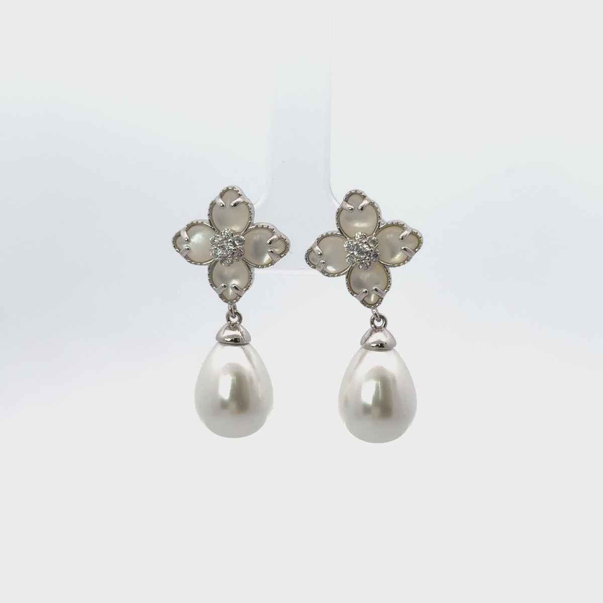 Rotating display the earrings.