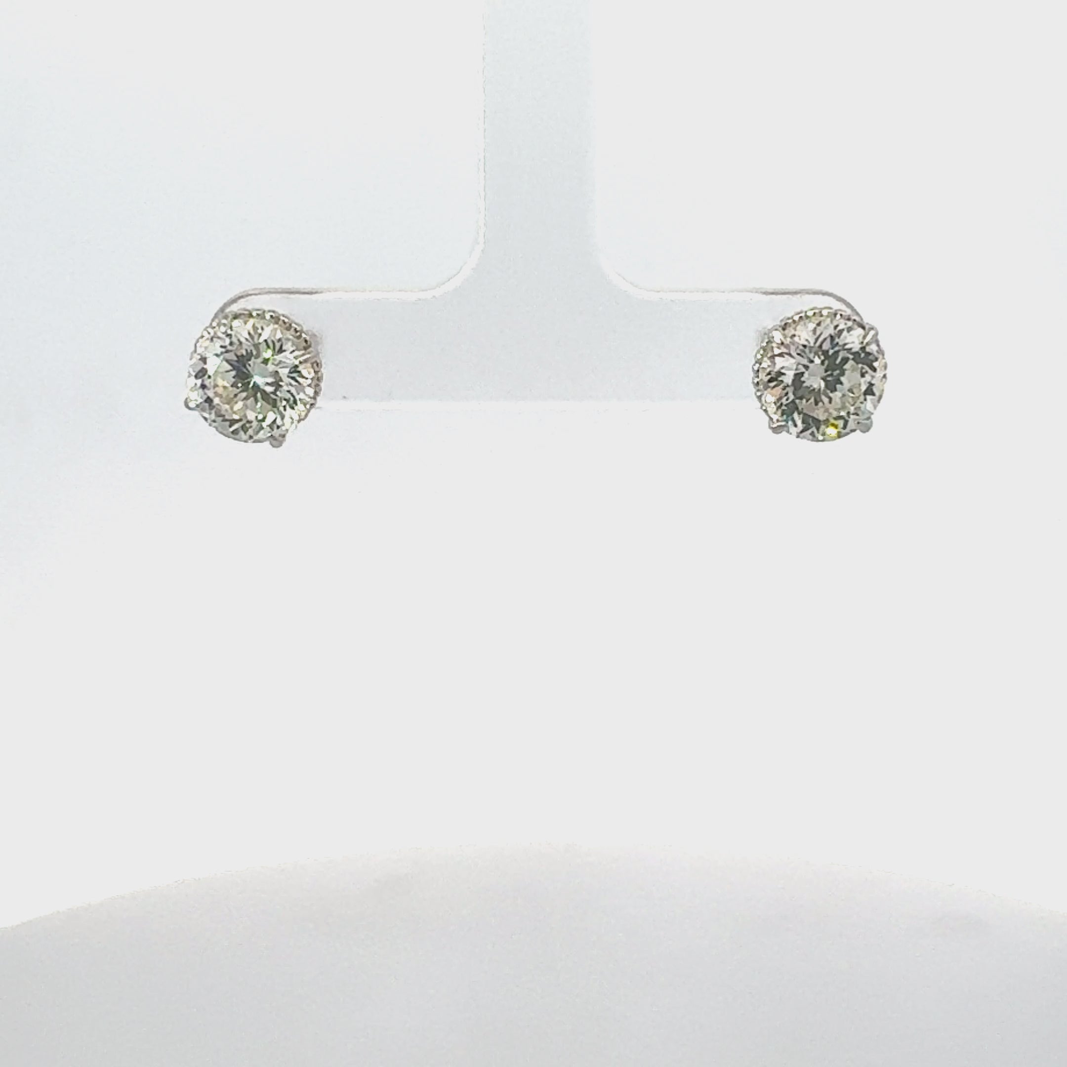 Video of Coronation Solitaire Stud Earrings Moissanite Silver, showing the drop, movement and scale from multiple angles.