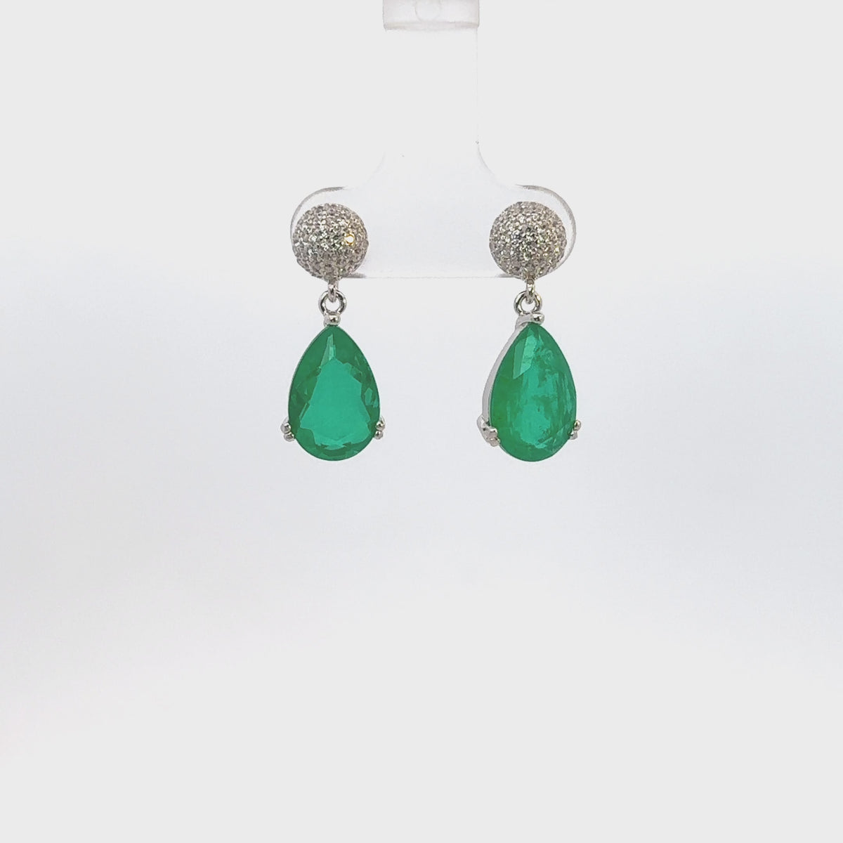 Rotating display the earrings.