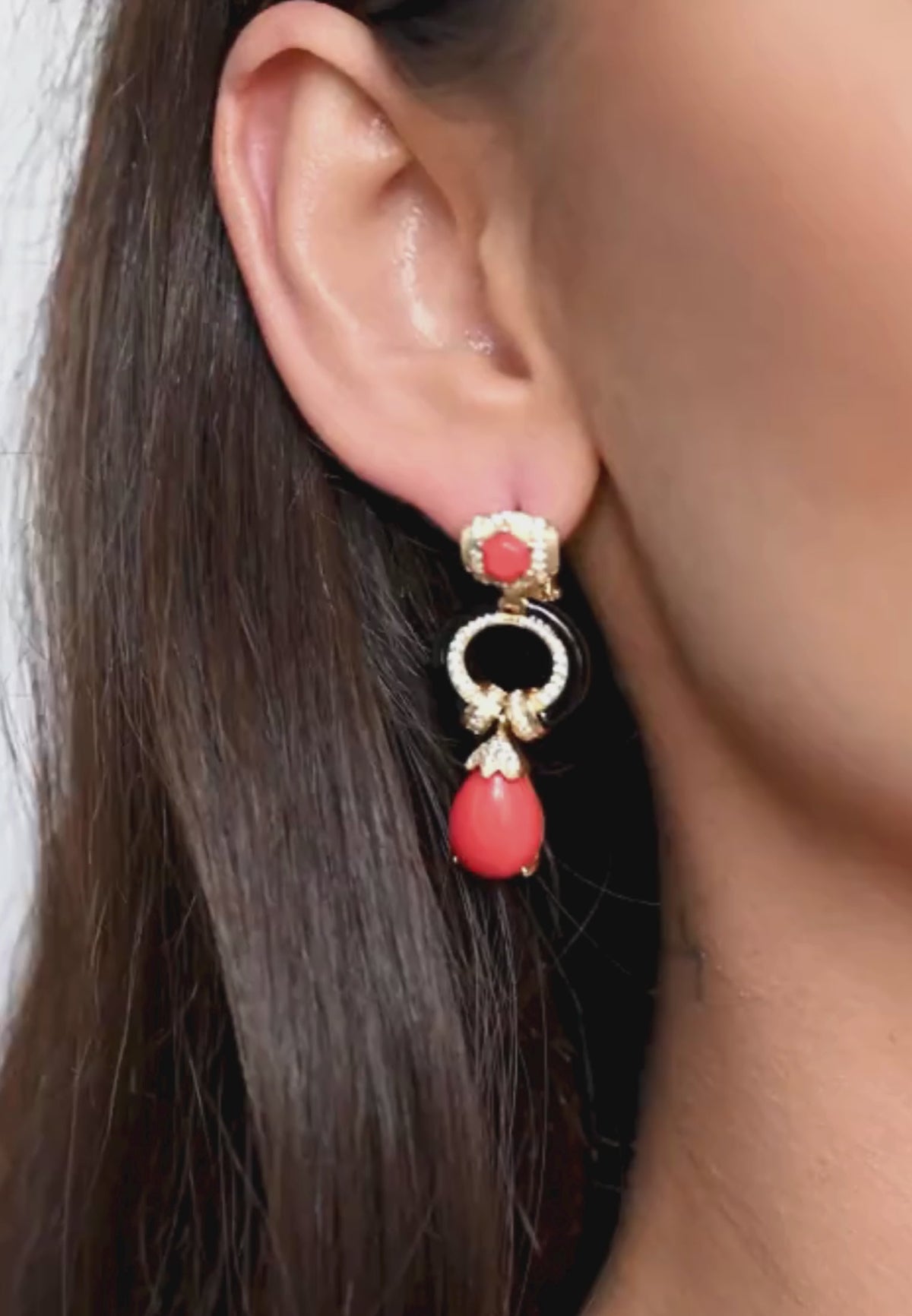 Close-up of the earring worn by a model.
