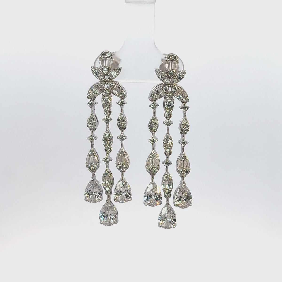 Rotating display the earrings.