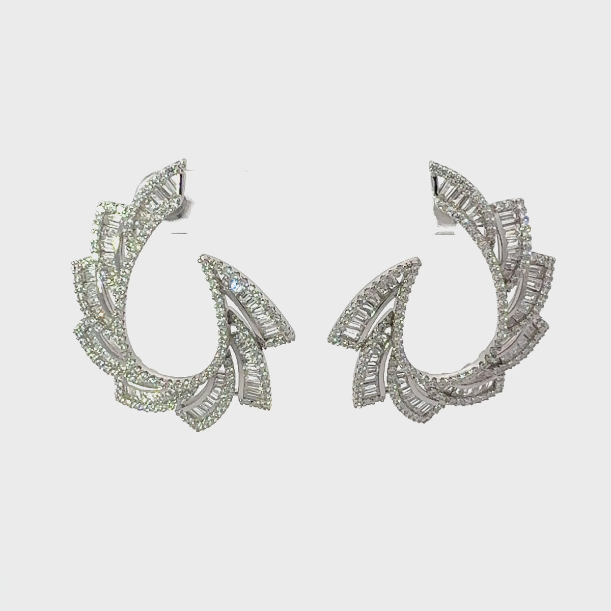 Video of Amara Sweeping Hoop Earrings Silver, showing the drop, movement and scale from multiple angles.