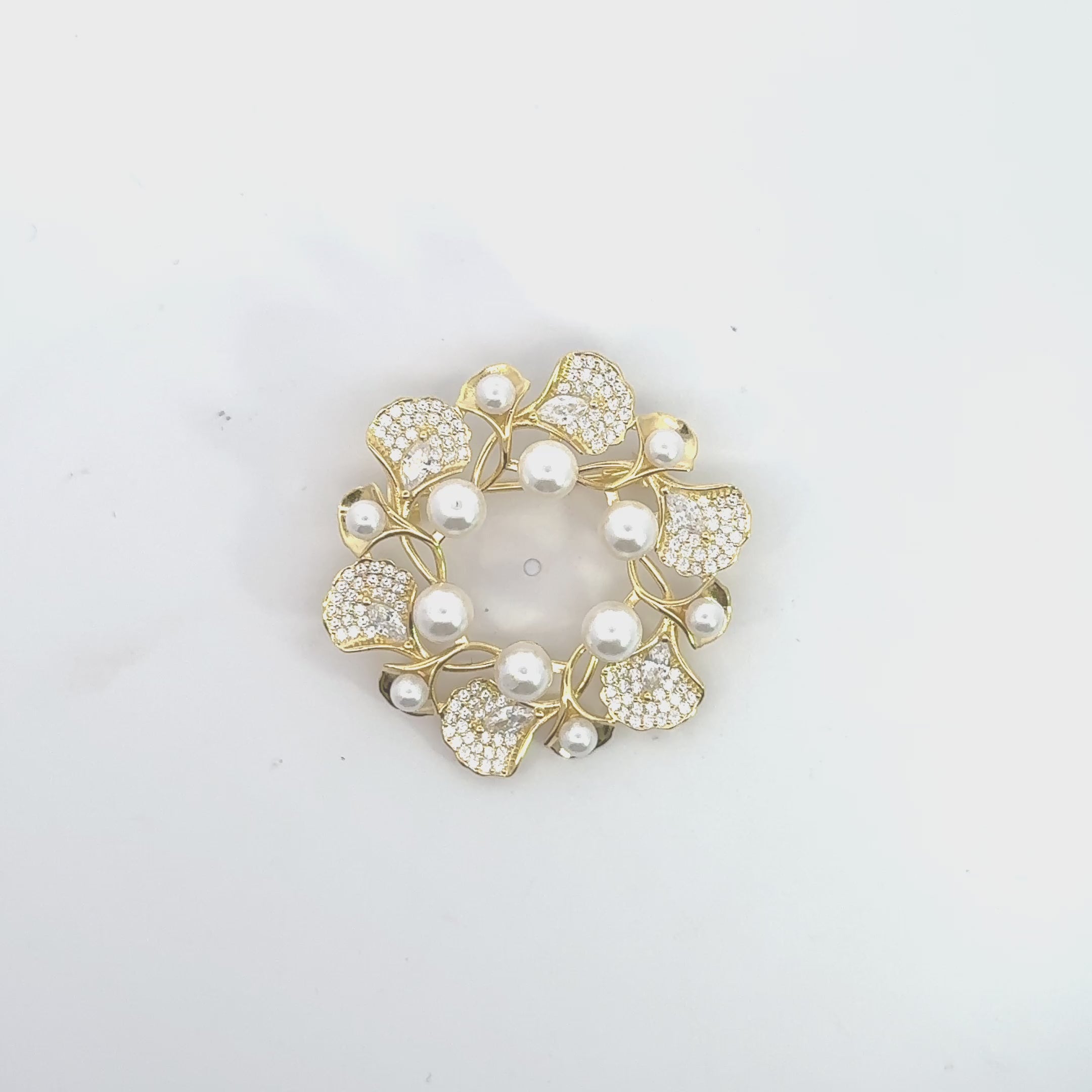 Video of Ginkgo Leaf And Pearl Wreath Brooch Gold, showing the design, finish and movement from multiple angles.