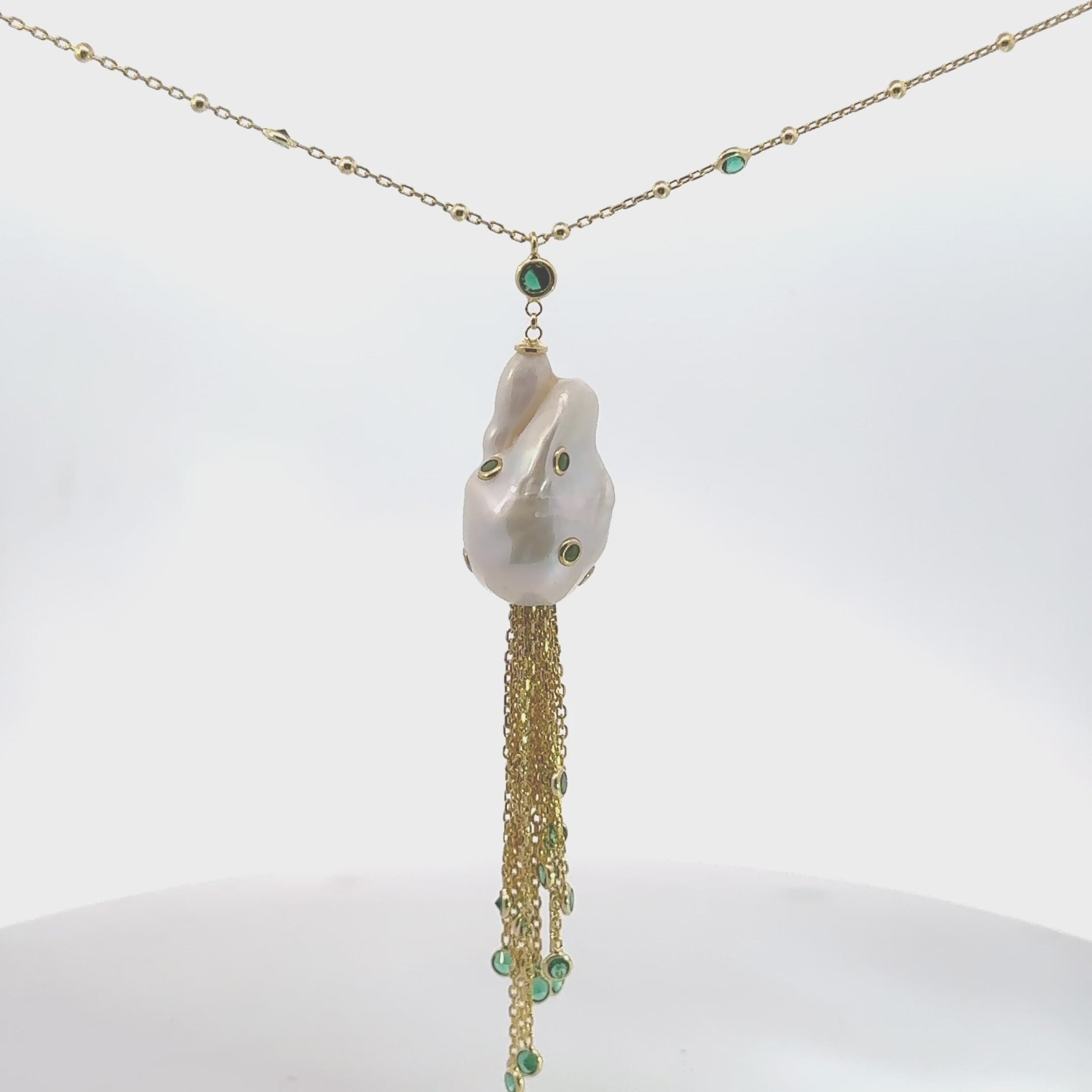 Video of Polka Dot Baroque Pearl Tassel Necklace Gold Emerald, showing the pendant, chain and scale from multiple angles.