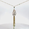 Video of Polka Dot Baroque Pearl Tassel Necklace Gold Emerald, showing the pendant, chain and scale from multiple angles.