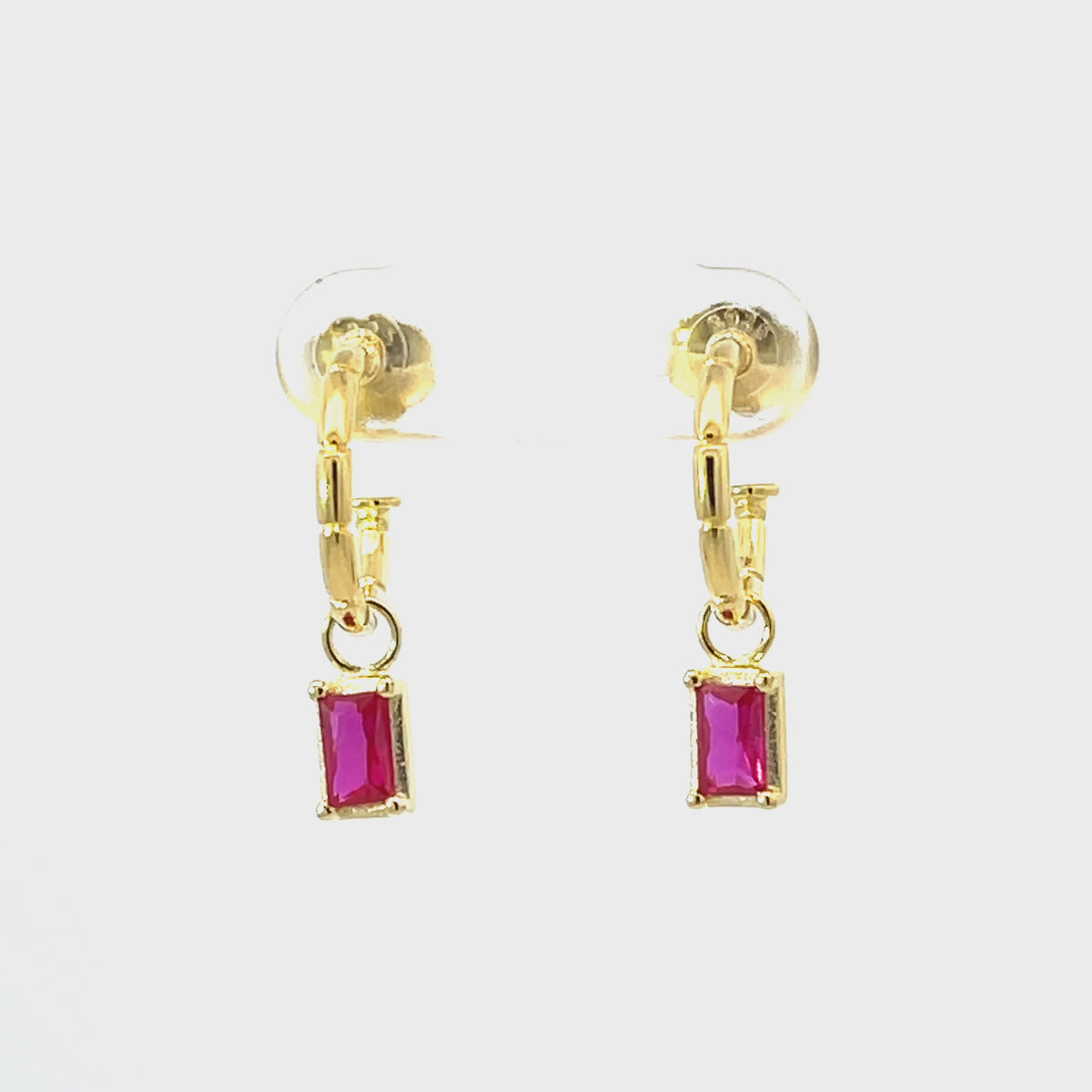 Video of Bamboo Hoop with Ruby Earrings Gold, showing the drop, movement and scale from multiple angles.