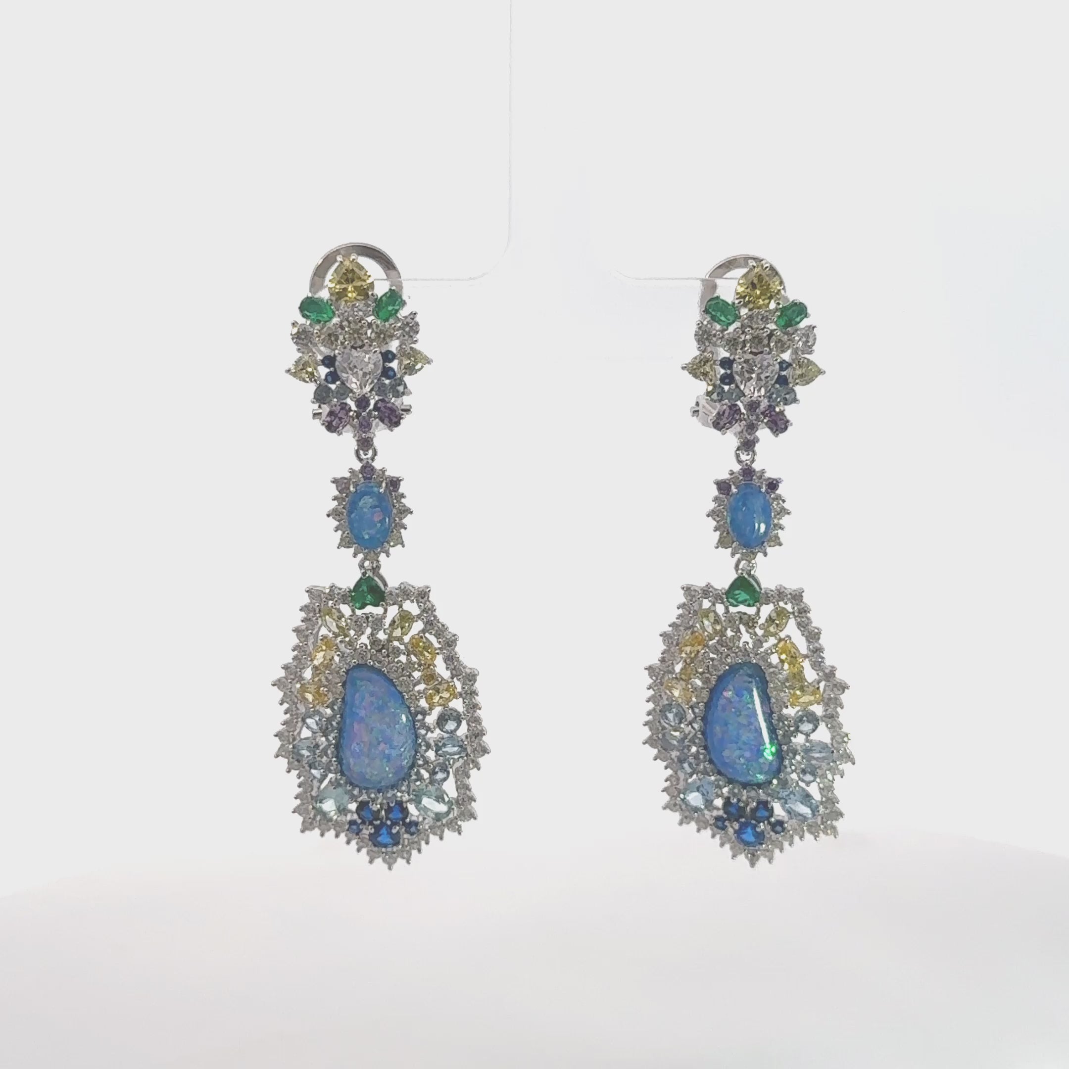 Video of Frida Blue Opal Rainbow Drop Earrings Silver, showing the drop, movement and scale from multiple angles.