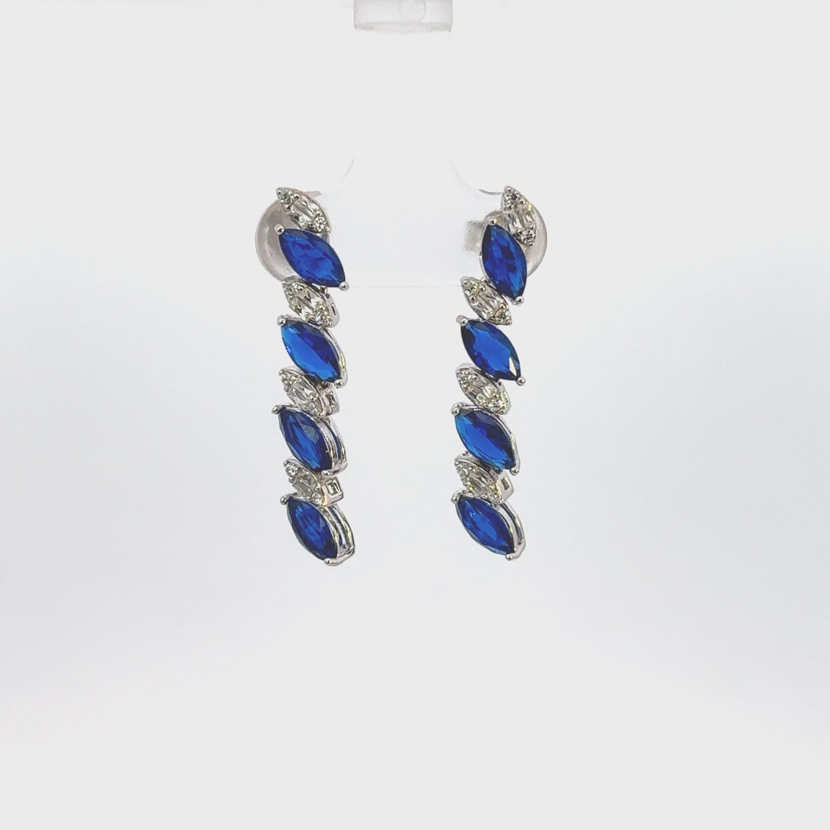 Rotating display the earrings.
