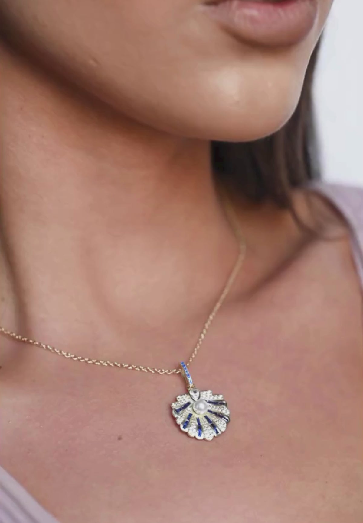 Close-up of the necklace worn by a model.