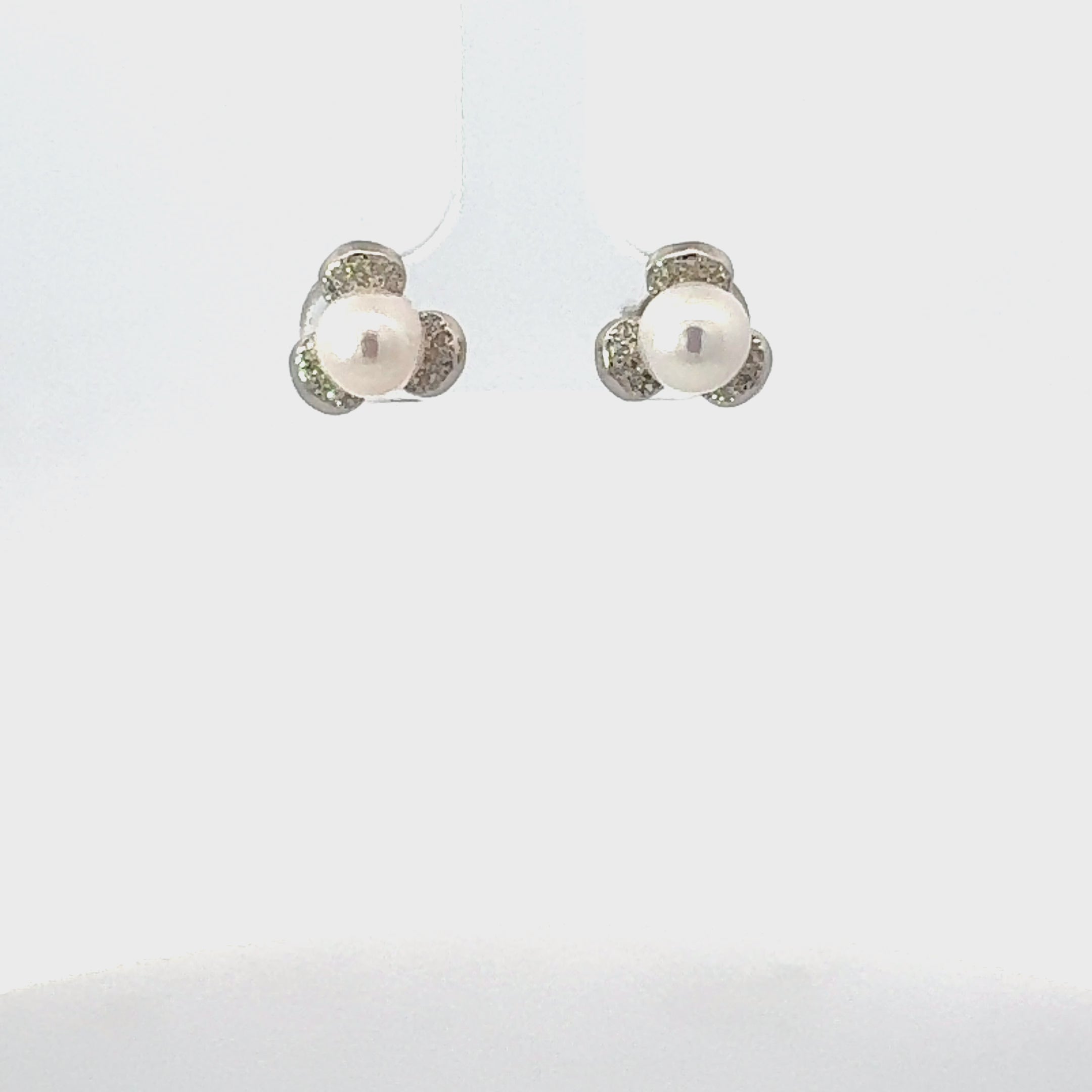 Video of Pearl Posy Stud Earrings Silver, showing the drop, movement and scale from multiple angles.