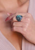 Close-up of the ring worn by a model.