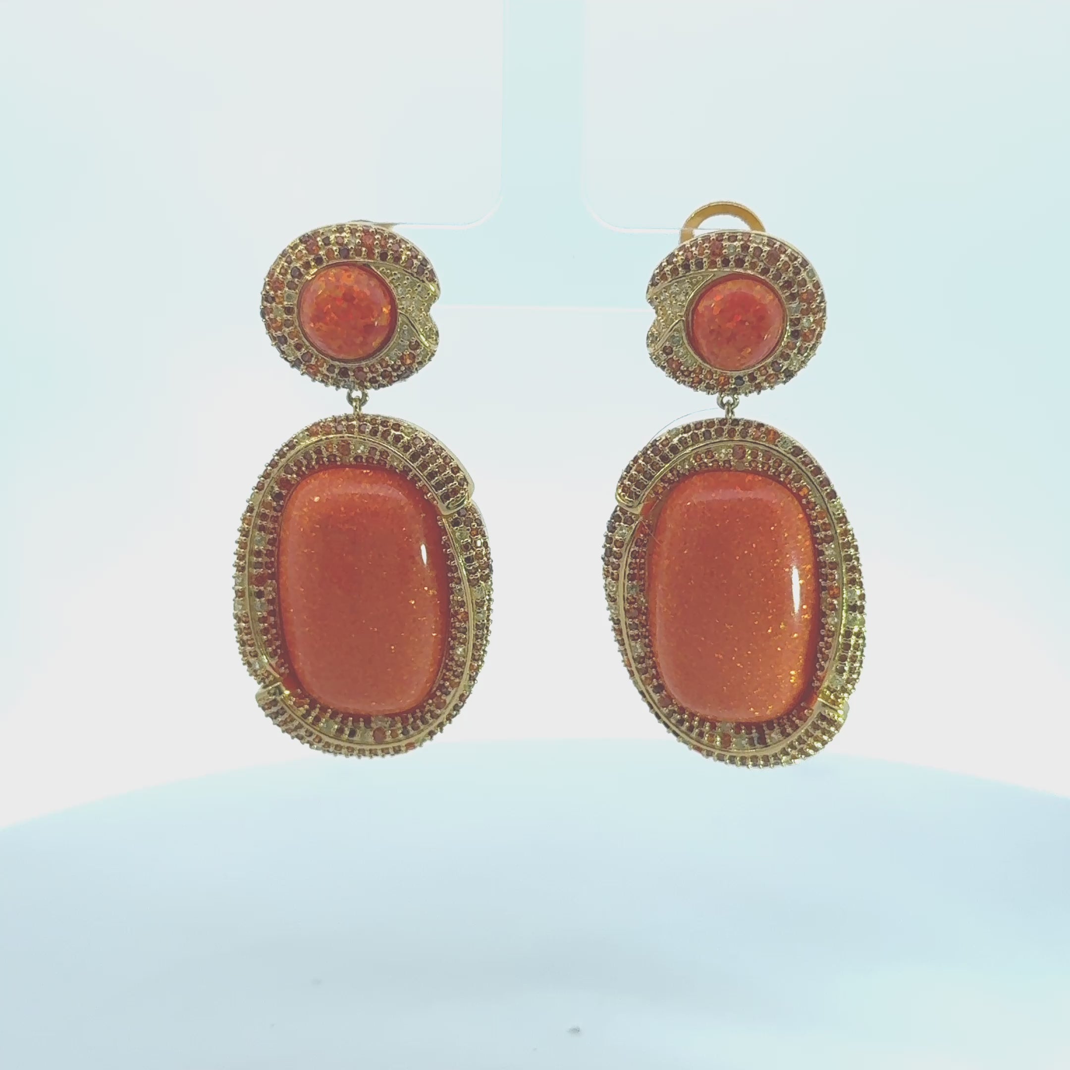Video of Fiorella Fire Opal Drop Earrings Gold, showing the drop, movement and scale from multiple angles.