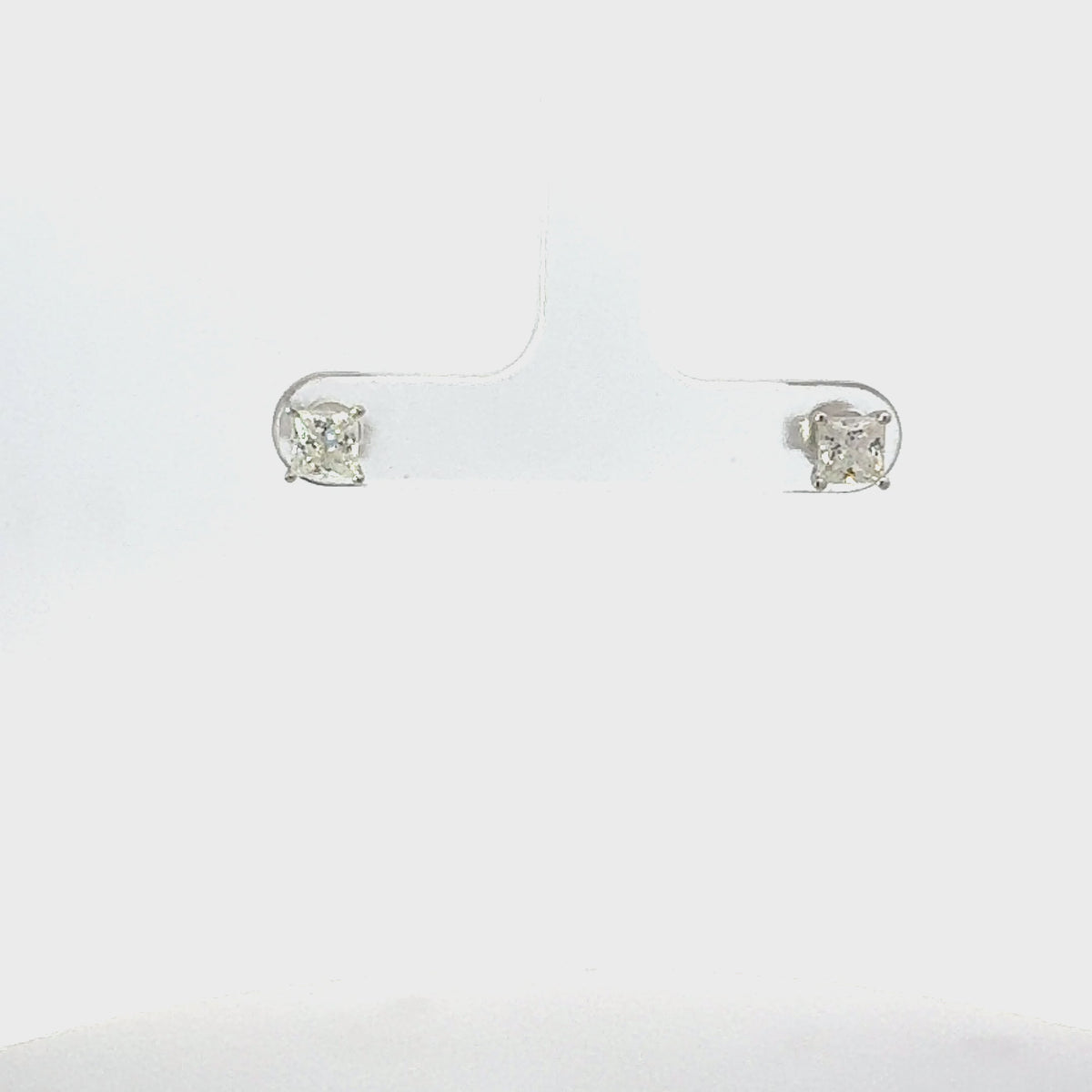 Video of Square Solitaire Stud Earrings Moissanite Silver, showing the drop, movement and scale from multiple angles.