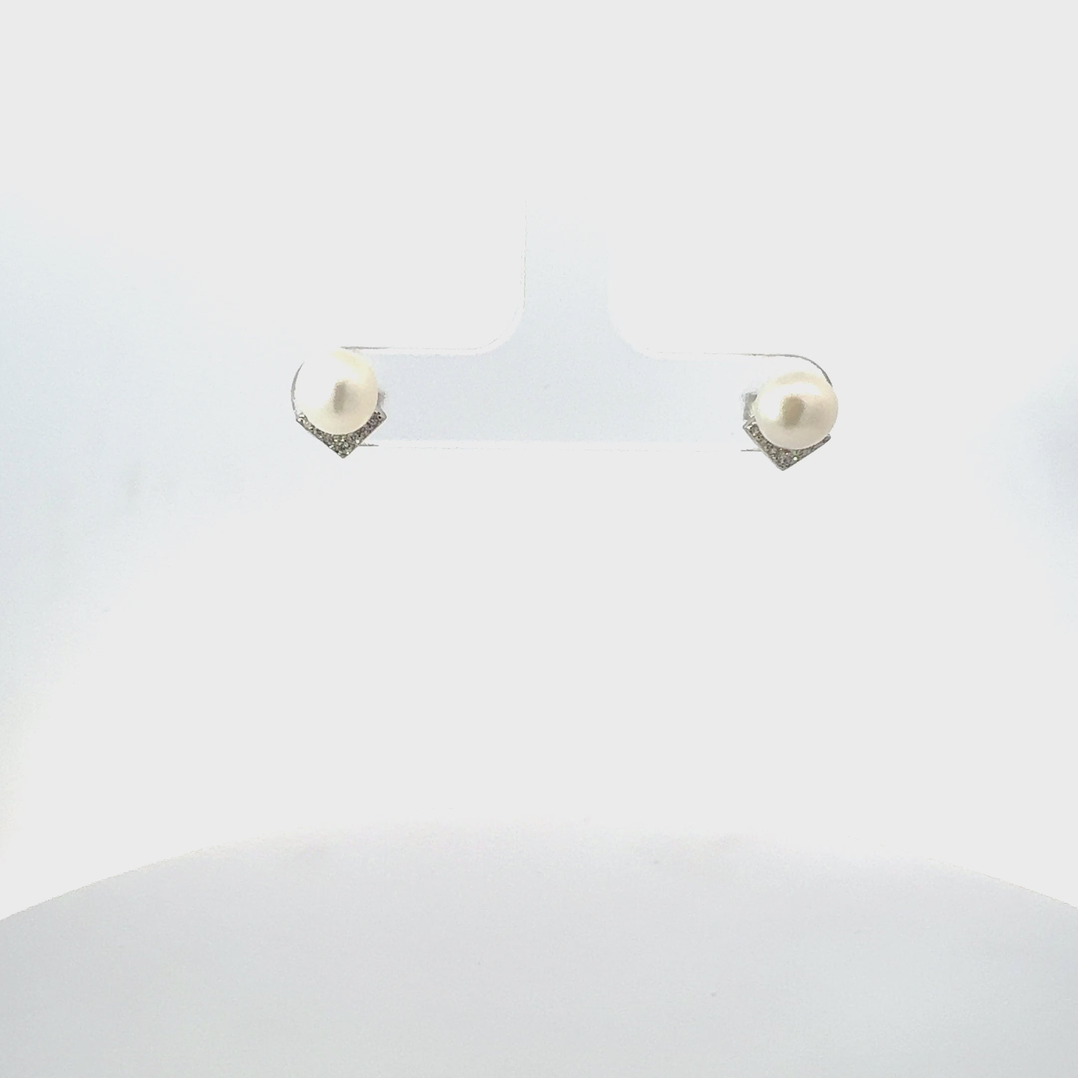Video of Pearl Angular Stud Earrings Silver, showing the drop, movement and scale from multiple angles.