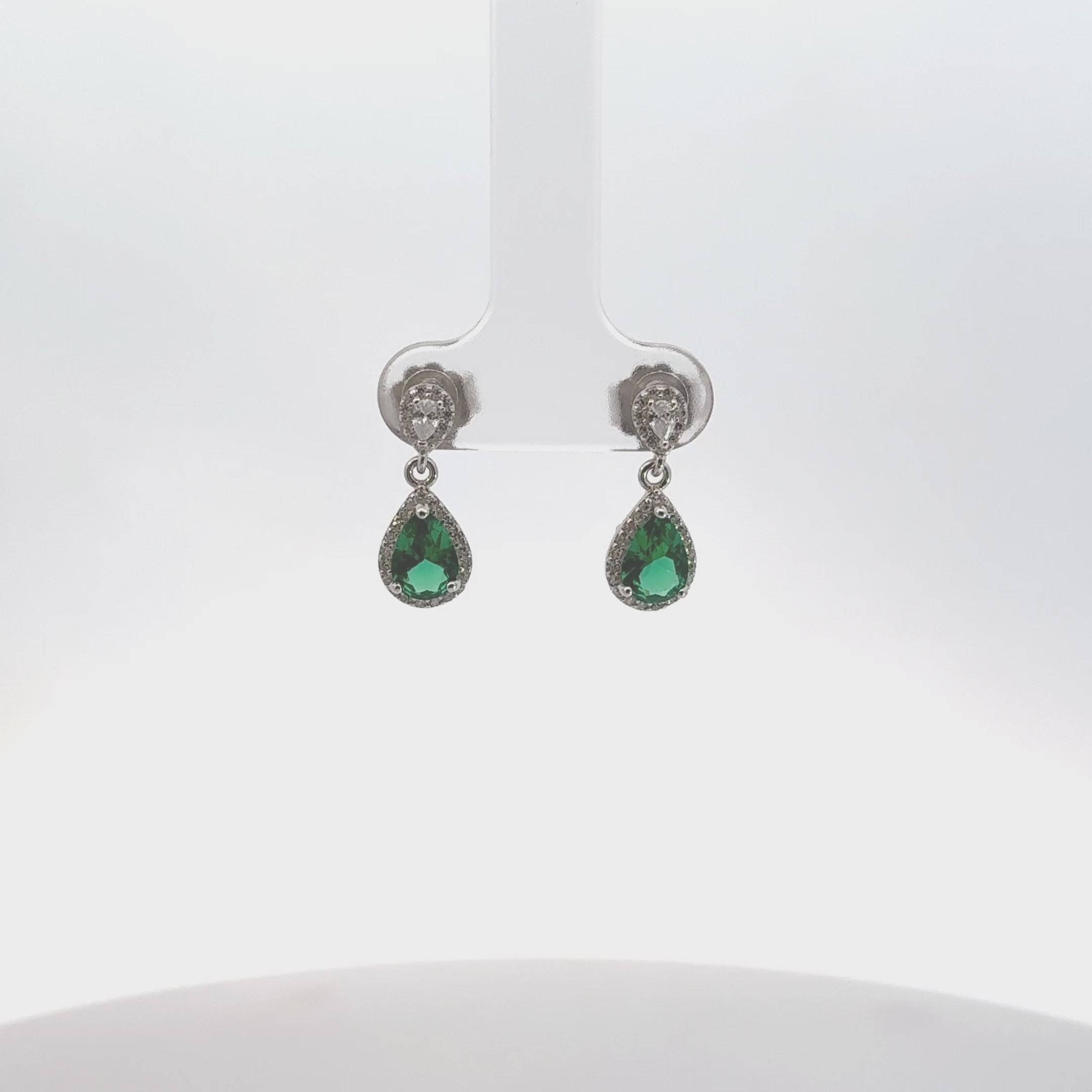 Video of Phillippa Drop Earrings Emerald Silver, showing the drop, movement and scale from multiple angles.