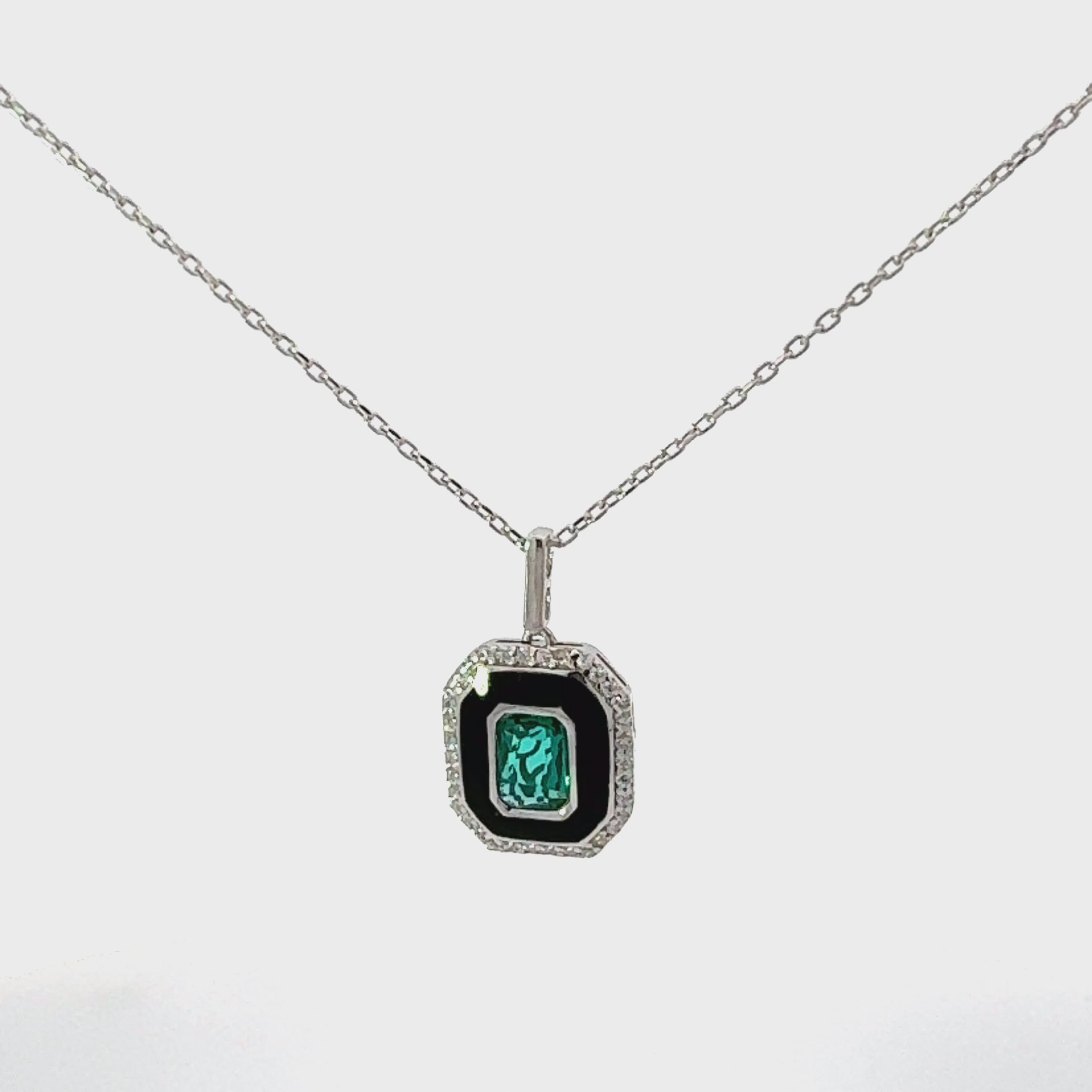 Video of Art Deco Emerald And Enamel Pendant Necklace Silver, showing the pendant, chain and scale from multiple angles.