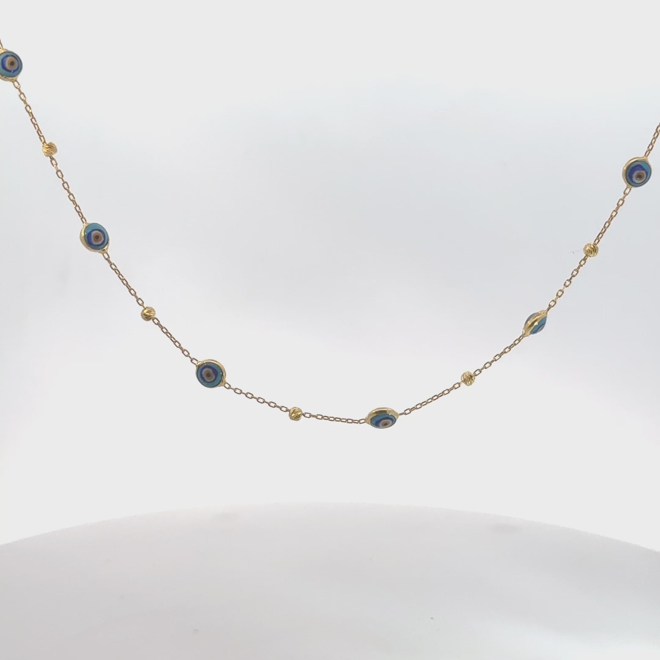 Video of Evil Eye Blue Enamel Beaded Chain Choker Necklace Gold, showing the pendant, chain and scale from multiple angles.