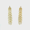 Video of Peacock Feather Elongated Drop Earrings Gold, showing the drop, movement and scale from multiple angles.