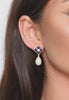 Close-up of the earring worn by a model.