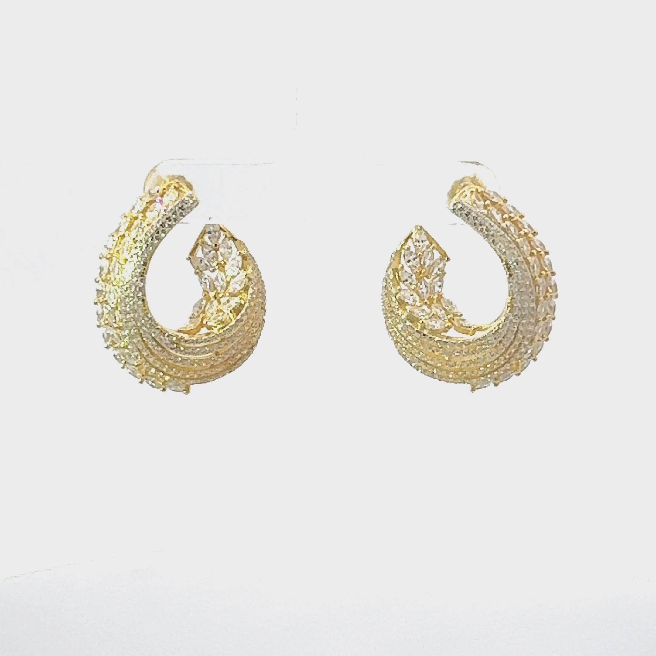 Video of Artemis Sweeping Hoop Earrings Gold, showing the drop, movement and scale from multiple angles.