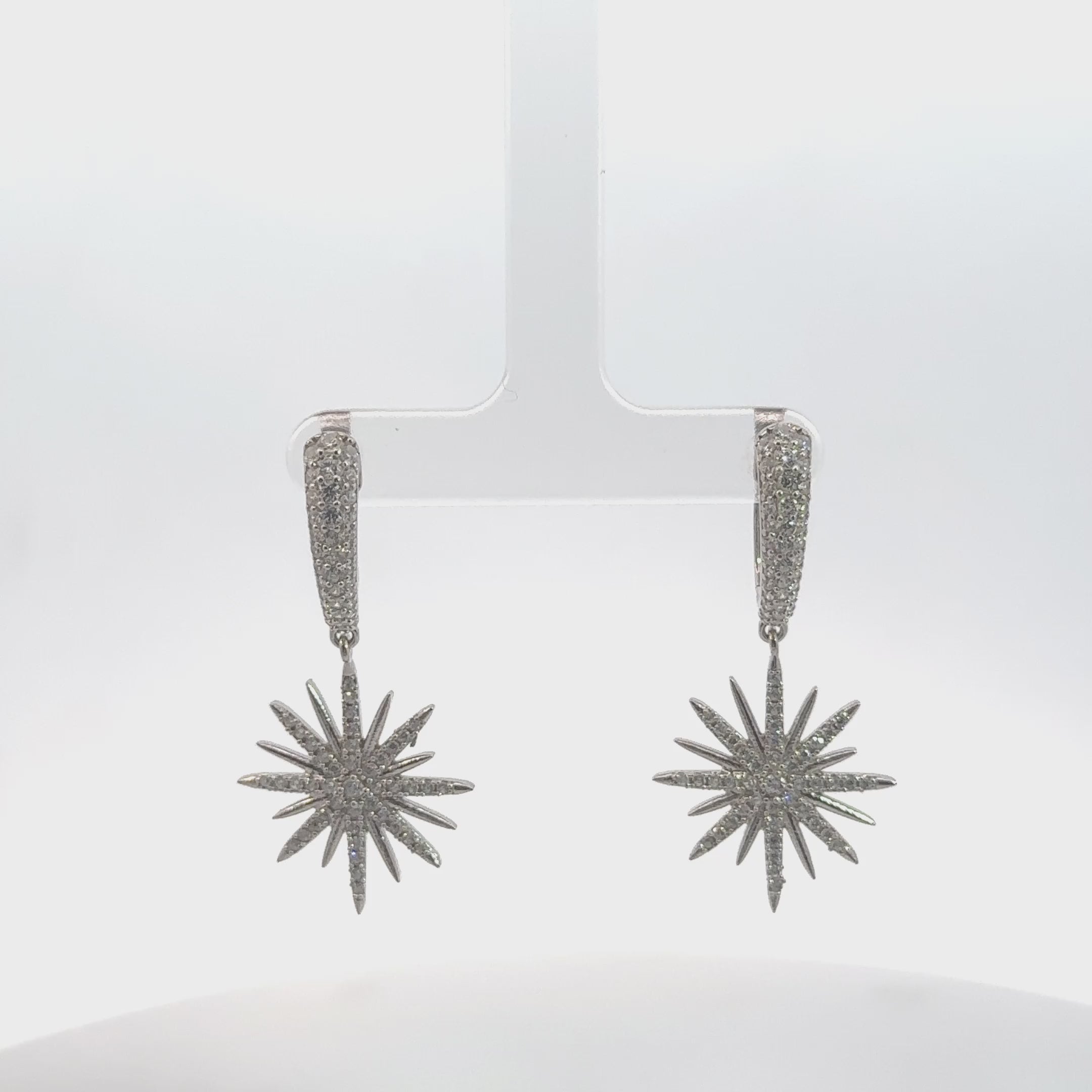 Video of Star Burst Drop Earrings Silver, showing the drop, movement and scale from multiple angles.