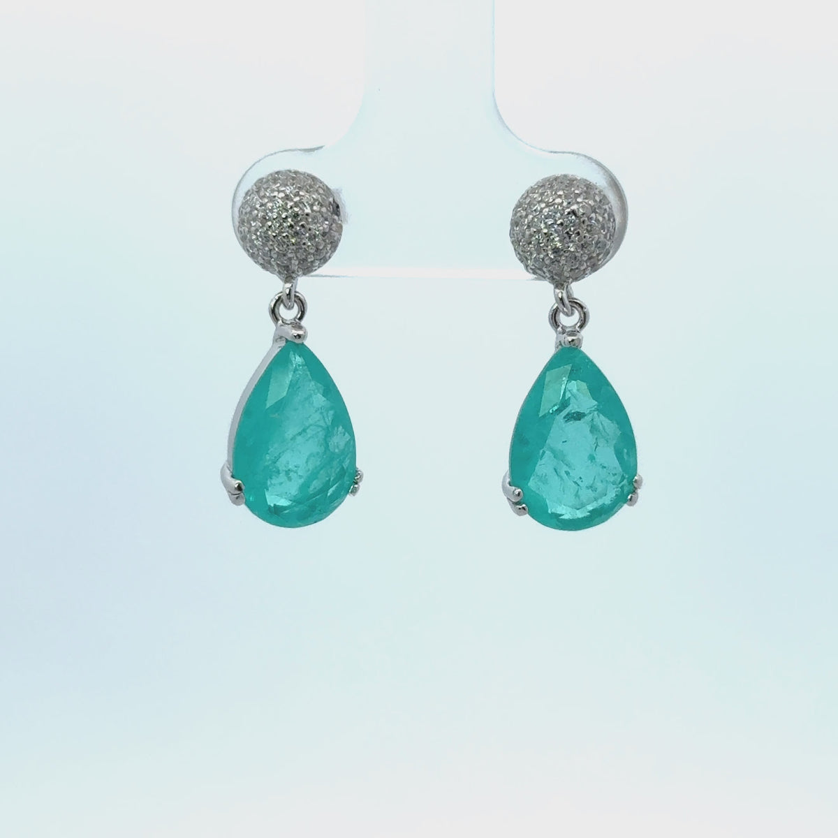 Rotating display the earrings.