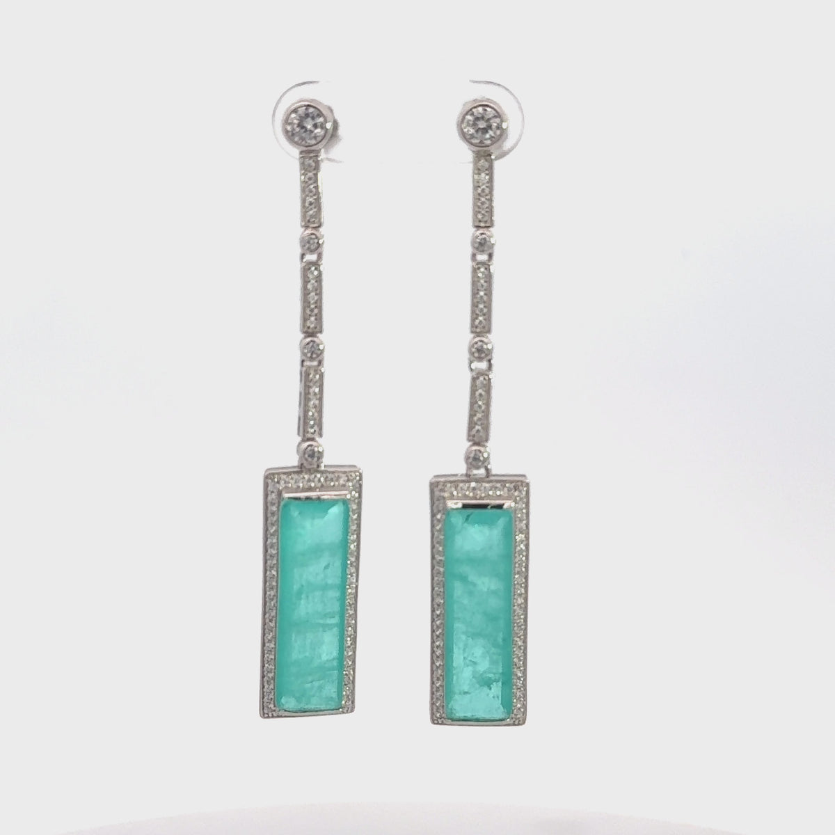 Rotating display the earrings.