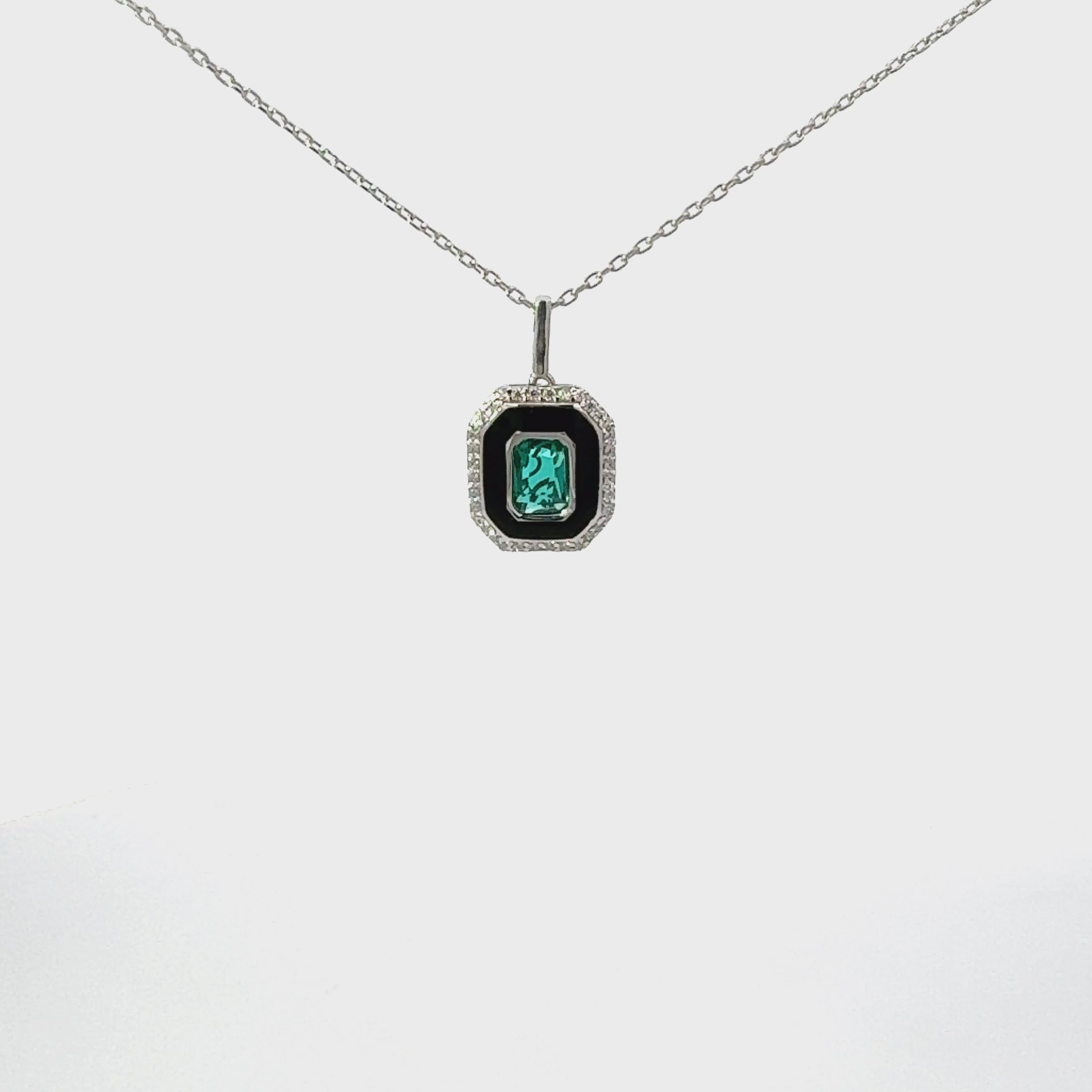 Video of Art Deco Emerald And Enamel Pendant Necklace Silver, showing the pendant, chain and scale from multiple angles.