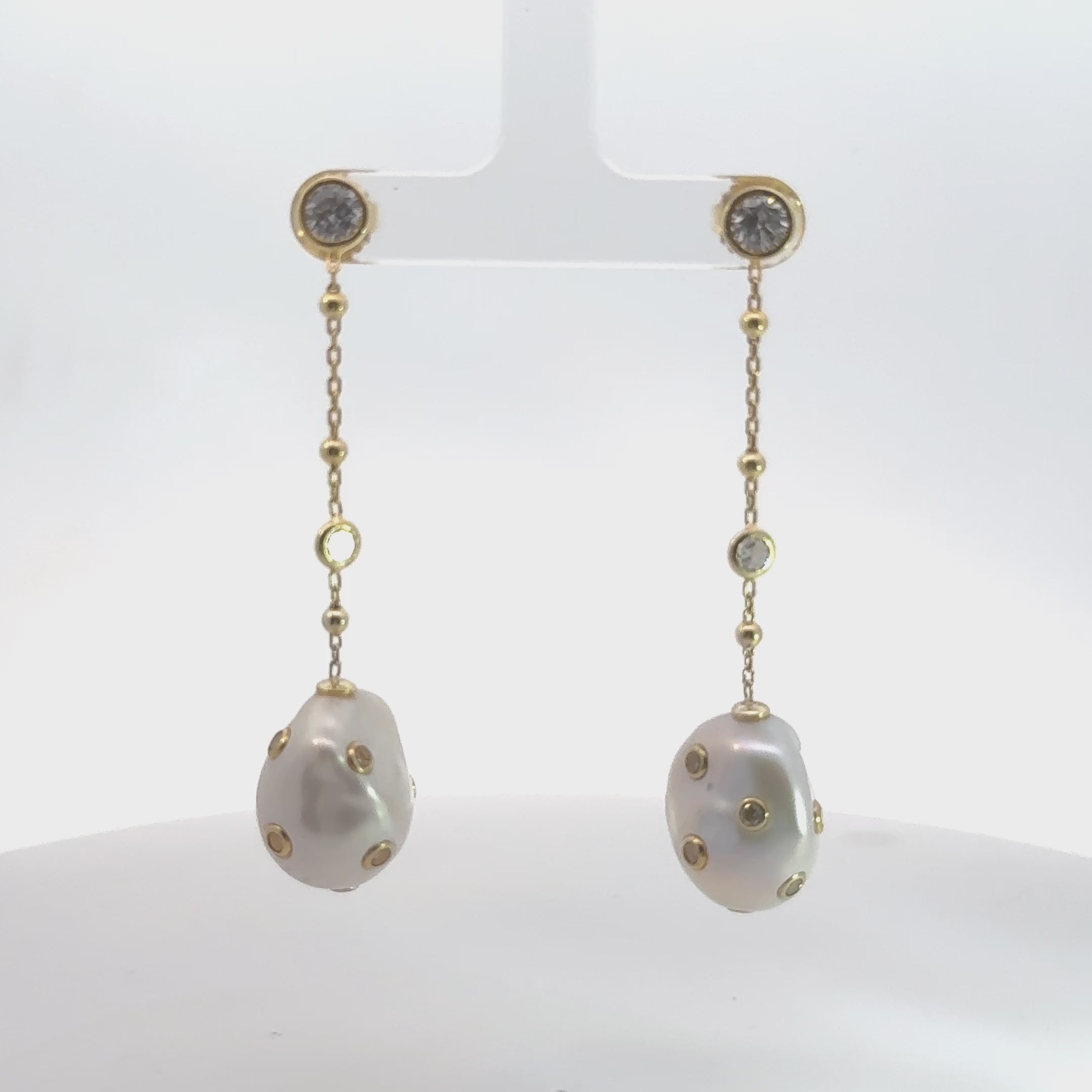 Video of Polka Dot Baroque Pearl Chain Drop Earrings Gold Cz, showing the drop, movement and scale from multiple angles.