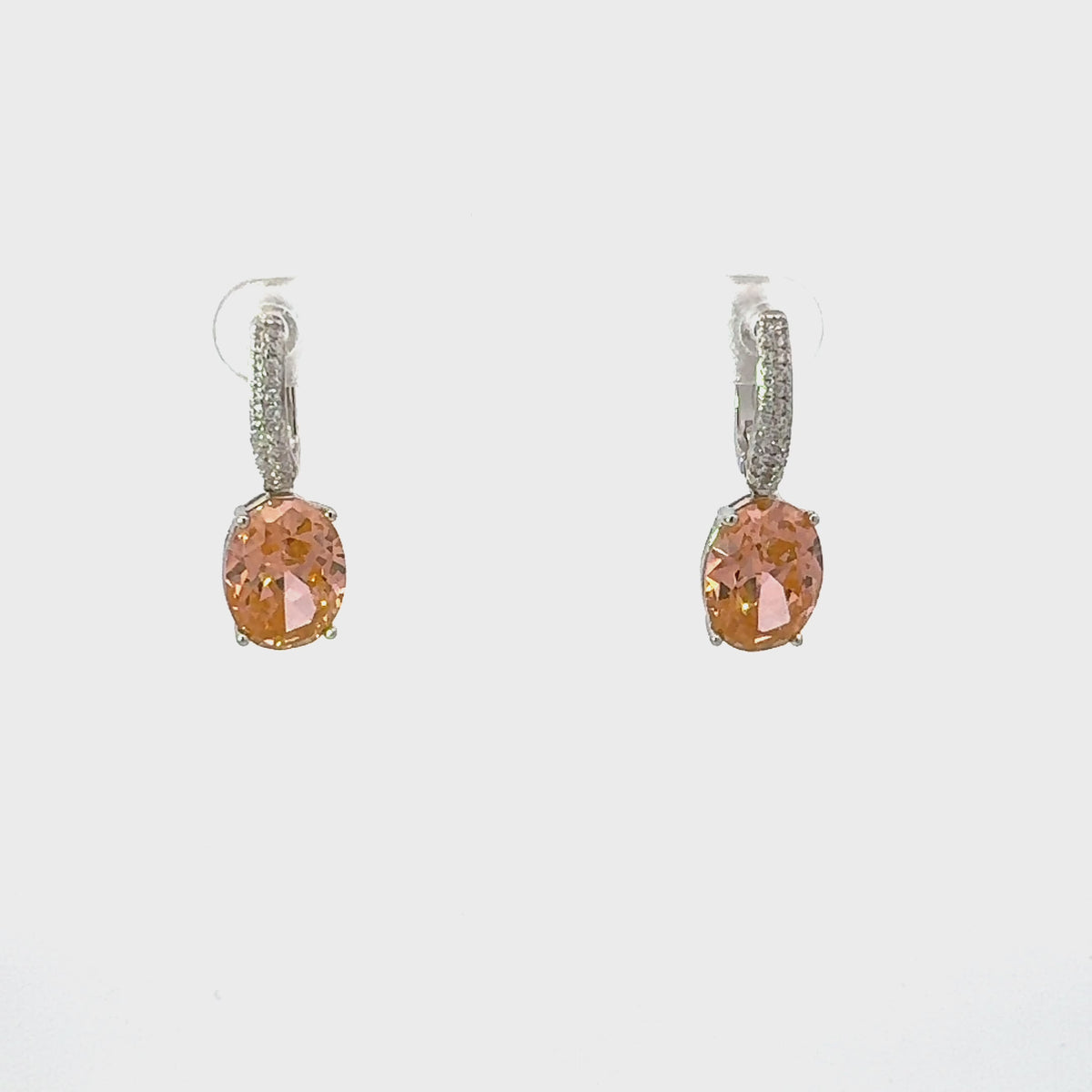 Video of Alexandra Oval Drop Earrings Silver Peach Quartz, showing the drop, movement and scale from multiple angles.
